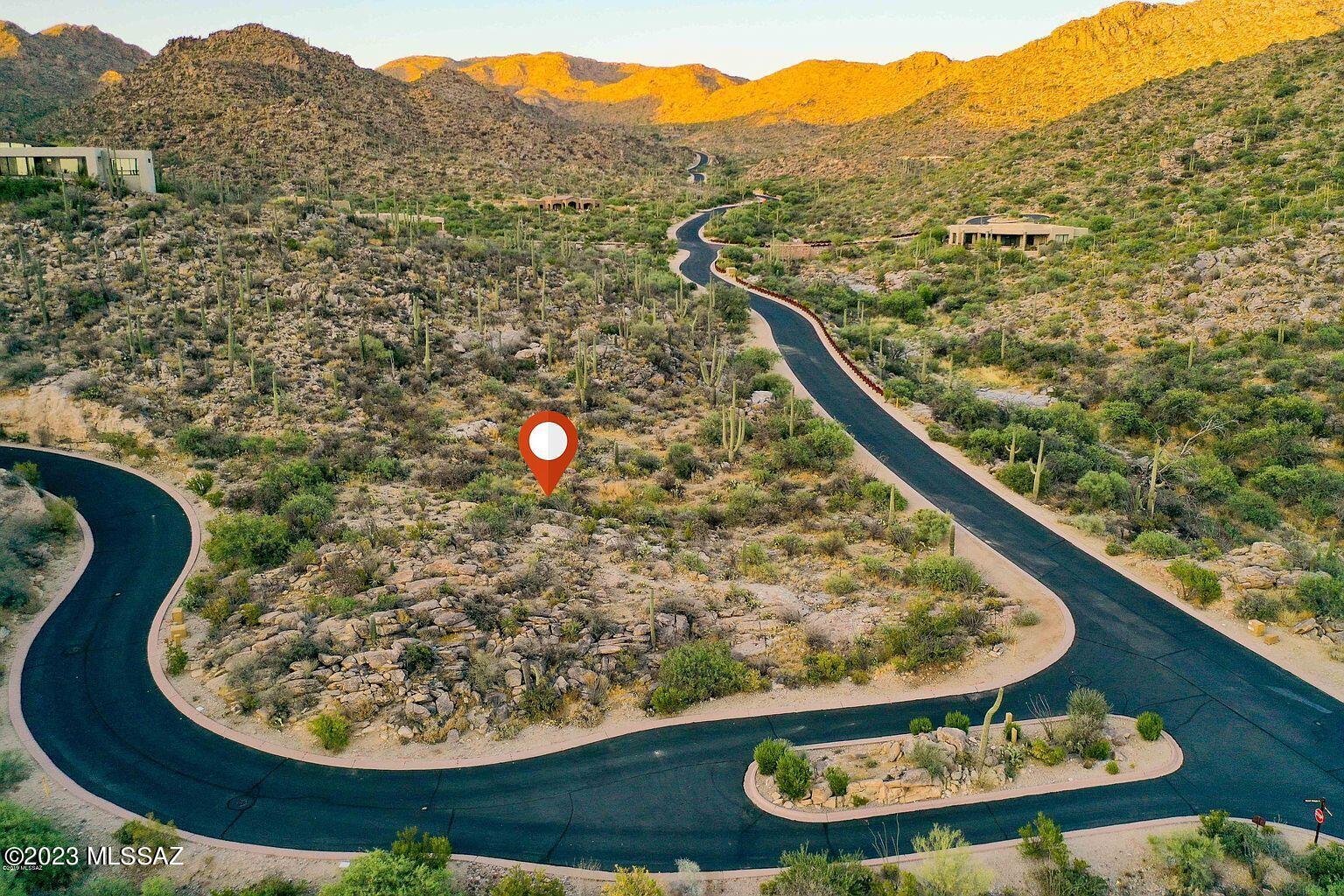 Exquisite Tortolita Mountains & endless canyon views from this peaceful yet showy custom lot in guard gated Canyon Pass at Dove Mountain. Canyon Pass is home to some of the most beautiful and unique custom homes in NW Tucson. Dove Mountain is home to Icon golf courses, endless hiking trails and nature & wildlife abounding. Shovel ready plans are available with this lot sale. Stunning  5594sf custom contemporary design already prepared for this lot. Plans/renderings will convey with lot purchase.  The plans have been approved by the Design Review Board.  Choice your own favorite  local builder or consider the masterpiece Architectural Firm ''Vertical Arts''who are available to fully execute this design.  This is a fabulous lot- ready to be built on right now!