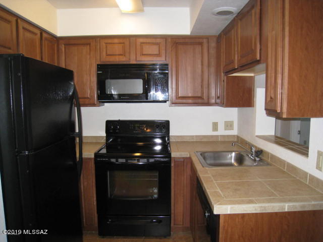 Desirable Gated Casa Club Condos has loads of great amenities for residents only!  Fitness center, clubhouse w/large screen TV, billiards, new tennis court, sand volley-ball, racquet ball, redwood sauna, 2 pools, 2 spas!  Just 2 miles from UofA campus & less than one block to busline & close to Mountain Ave bike path, shops, restaurants & more!  Private patio has extra storage closet & gorgeous views of the Catalina Mtns.  Kitchen has plenty of nice oak cabinets, black appliances & space for eat-in table/chairs.  Easy-care ceramic floors in living areas & bdrm.  Sliding doors in both LR & Bdrm for patio access.  One reserved co'v parking space.  Owner pays water & tenant only pays electric.; small pet on approval w/dep, pet fee & pet rent.  Reserve now & beat the school-year rush!