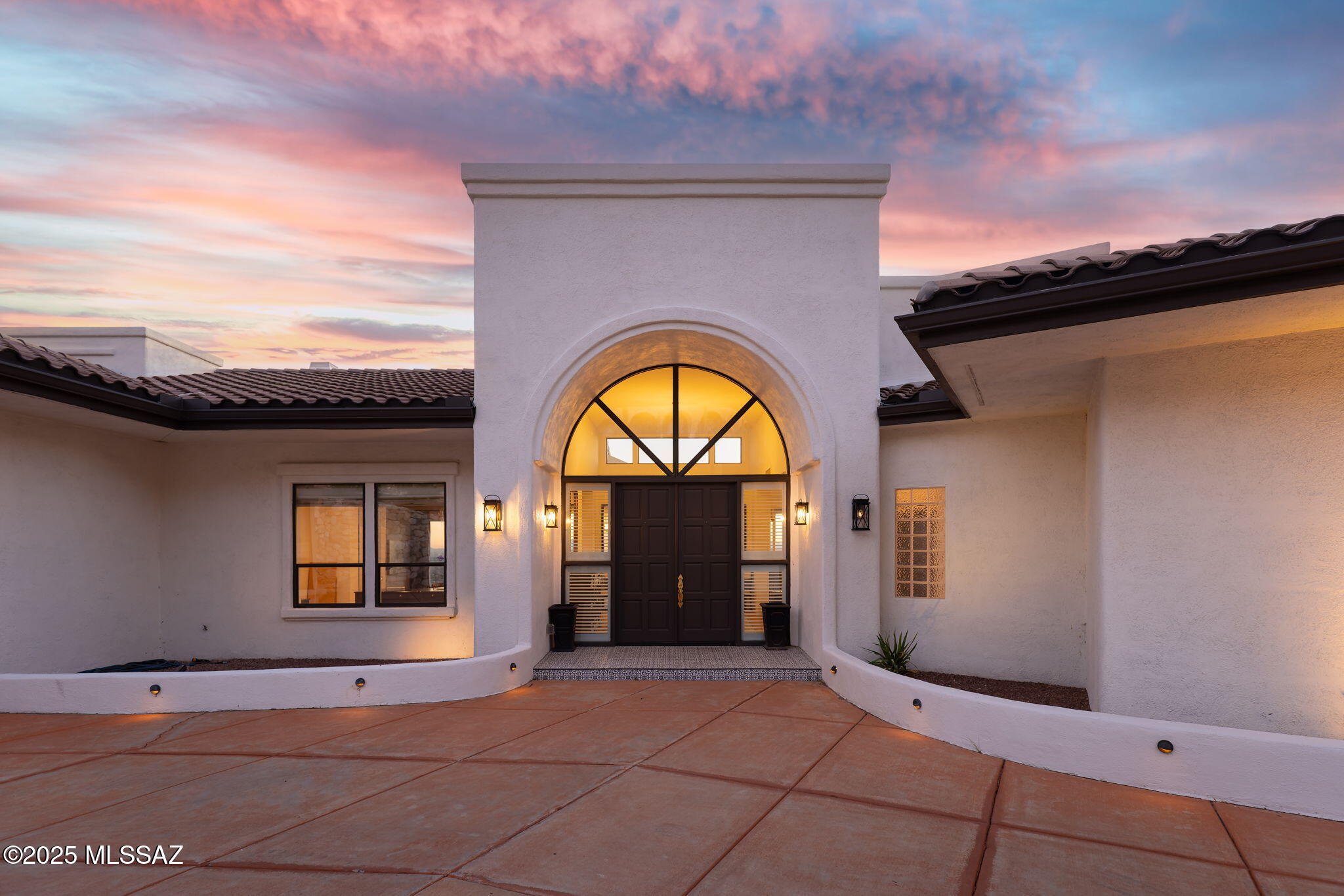 Situated high above the city in the prestigious and guard-gated Skyline Country Club Estates, the residence at 5130 E. St. Andrews Drive commands what are widely regarded as some of the most extraordinary views in all of Tucson. From its elevated setting, the home captures sweeping panoramic city views, dramatic desert sunsets, and breathtaking vistas of the Santa Catalina Mountains, creating a constantly changing backdrop that defines luxury living in the Catalina Foothills. By day, the landscape stretches endlessly across the valley; by night, the city lights shimmer below, offering a truly iconic Tucson experience. The home has been thoughtfully remodeled and updated, blending refined architectural detail with modern comfort. Rich updated wood flooring flows throughout expansive living areas, adding warmth and sophistication while complementing the home's scale and open design. The gourmet kitchen serves as both a functional centerpiece and an elegant gathering space, featuring premium stainless steel Viking appliances, granite countertops, custom cabinetry, and generous workspace designed for entertaining as well as everyday living.

Designed with lifestyle and entertainment in mind, the residence features a massive recreation room that elevates the home into a private resort environment. This impressive space includes a custom bar and a dedicated movie theater, creating an ideal setting for hosting gatherings, celebrations, or relaxed evenings with family and friends. The home's thoughtful layout allows for seamless flow between living, entertaining, and private spaces, while expansive windows consistently frame the stunning views that define the property.

Much of the home is offered with its furnishings, providing a rare opportunity for a turnkey luxury experience and allowing the next owner to immediately enjoy the property's refined style and comfort. An RV garage, an uncommon and highly valuable feature within Skyline Country Club Estates, offers secure storage and added versatility, appealing to those who value travel, recreation, and additional capacity without compromise.

Skyline Country Club Estates is one of the most established and sought-after luxury communities in Tucson, known for its privacy, security, and proximity to world-class amenities. At its center is the private Skyline Country Club, a landmark Catalina Foothills institution offering a full suite of resort-style amenities. The club features a championship golf course carved into dramatic desert terrain, enhanced by elevation changes and panoramic views that make every round unforgettable. Members also enjoy tennis and pickleball facilities, a heated resort-style swimming pool, a modern fitness center, and a vibrant social calendar that fosters a strong sense of community and connection.

Dining at Skyline Country Club ranges from casual to refined, with multiple venues offering elevated cuisine and sweeping views that enhance every gathering. The club is known for its welcoming yet sophisticated atmosphere, where social events, celebrations, and everyday leisure blend seamlessly into an active, upscale lifestyle. Living within Skyline Country Club Estates provides the rare opportunity to enjoy a private club environment while maintaining the comfort and exclusivity of a luxury residential setting.

Beyond the gates, residents enjoy immediate access to the best of the Catalina Foothills, including fine dining, upscale shopping at La Encantada, renowned hiking and outdoor recreation, and convenient access to downtown Tucson. The property is located within the highly acclaimed Catalina Foothills School District, further enhancing its appeal for those seeking educational excellence alongside an exceptional quality of life.

5130 E. St. Andrews Drive is more than a homeit is a statement of lifestyle, offering unparalleled views, refined living spaces, and access to one of Tucson's most prestigious country club communities. This is luxury Catalina Foothills living at its finest, where privacy, elegance, and breathtaking scenery come together in perfect balance.
