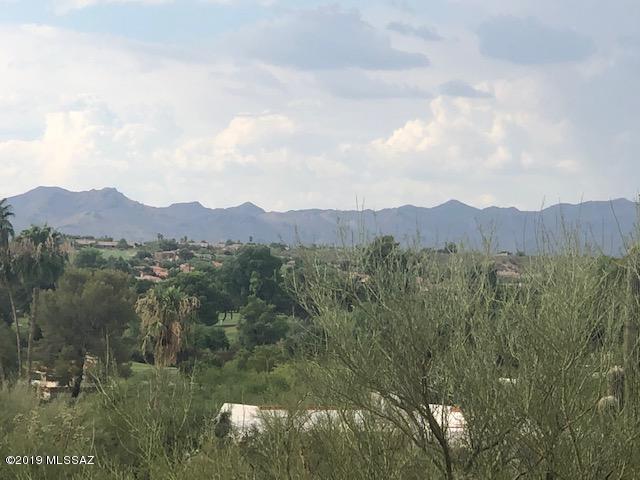 Range Pricing 780,000-925000.  This incredible lot is ready to build on. Located on a flat elevated lot to allow for mountain and golf course views. Located in Tucson National which is a prime location. Close to schools, shopping, Malls, Hospitals. All utilities are to the lot line. Easy lot to build on. Many new homes are being built in the subdivision. Plans are available for a 3200 sq. ft 4 bed, 3 bath home with a 4 car garage. All Block construction in this subdivision.