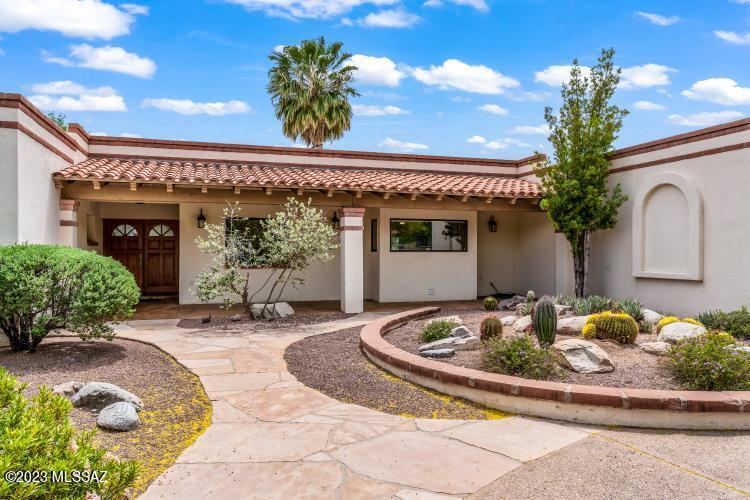 Live the Tucson Lifestyle in this beautiful Sabino Vista home. This quality-built Arena home features masonry construction with Pella windows, natural wood-finish raised panel doors, spacious rooms and updated baths. Great cook's kitchen with center island, maple cabinets and granite counters.  Peaceful, private back yard features sparkling pool & spa, mesquite canopy, Deep porch and nice size yard for entertaining. An impeccably maintained home.