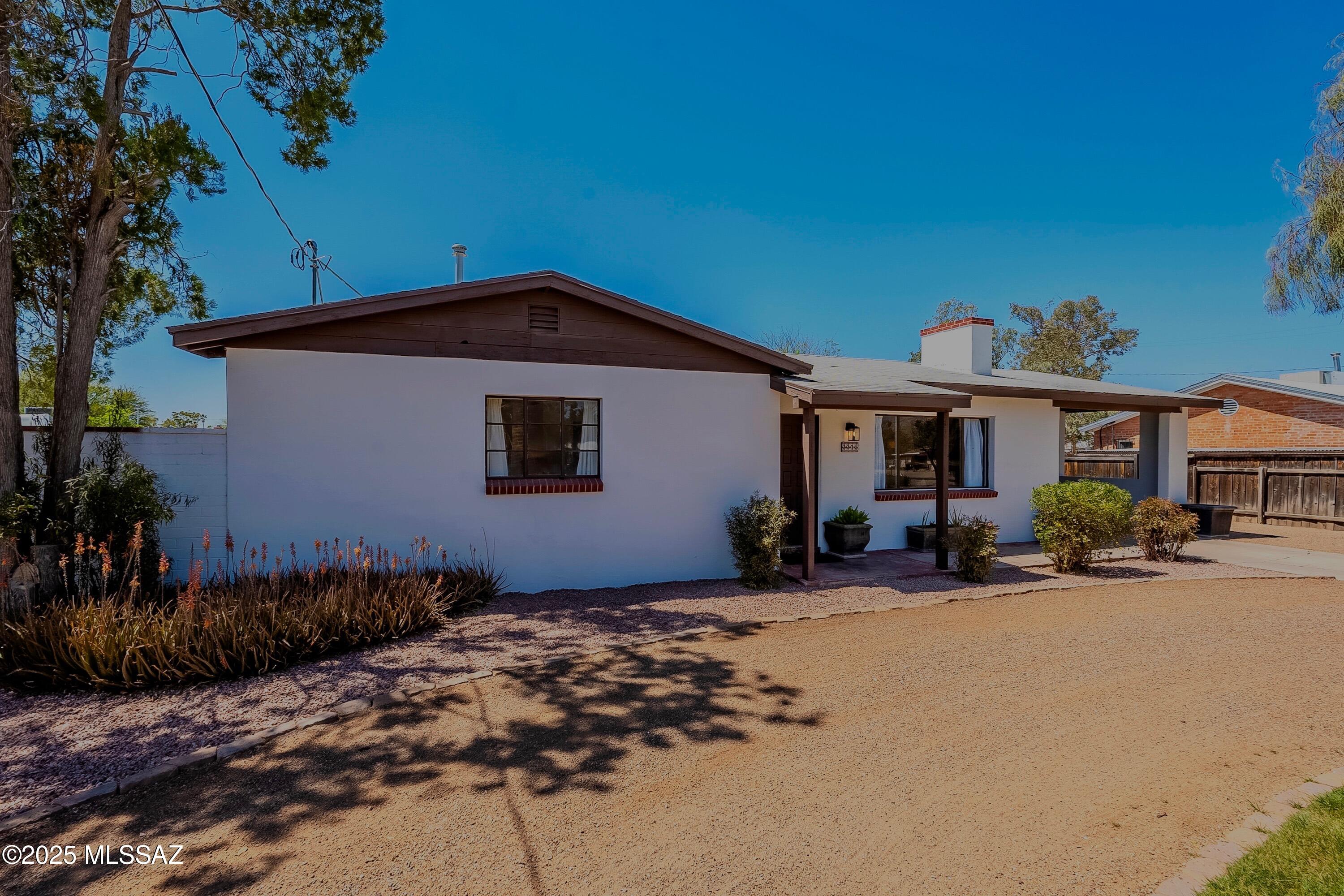Motivated Seller - All Offers Welcomed! Discover timeless charm and modern comfort in this beautiful midcentury home in the highly desirable Richland Heights East—no HOA! Landscaped lot with efficient irrigation, this home features a cozy fireplace, custom architectural details, a personal library, and energy-efficient HVAC upgrades, including a 2 year old main A/C and 2 new mini splits. The expansive backyard offers endless potential—ideal for a pool, guest house, or RV parking. Perfectly positioned just minutes from the University of Arizona, Banner UMC, shopping, dining, and Tucson's beloved Winterhaven neighborhood. Cross the Street in December and enjoy the festival of lights. A prime opportunity for first-time buyers, investors, or short-term rental potential. Owner Agent