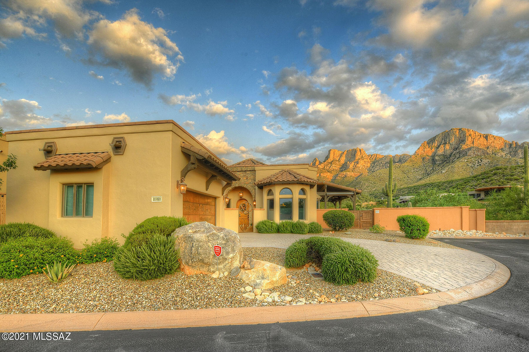 Gorgeous Semi-Custom 2 Bedroom+Den home located in the gated La Reserve Community with unobstructed mountain views! You will not be disappointed when you enter the home through the gated courtyard. You are welcomed in with vaulted wood ceilings, custom windows, and a rock surround fireplace. The gourmet kitchen features granite countertops, custom cabinets, and stainless steel appliances. Out back you will find your entertainers paradise! Sparkling heated pool and spa, built in bbq, and views galore! Make this home yours today.