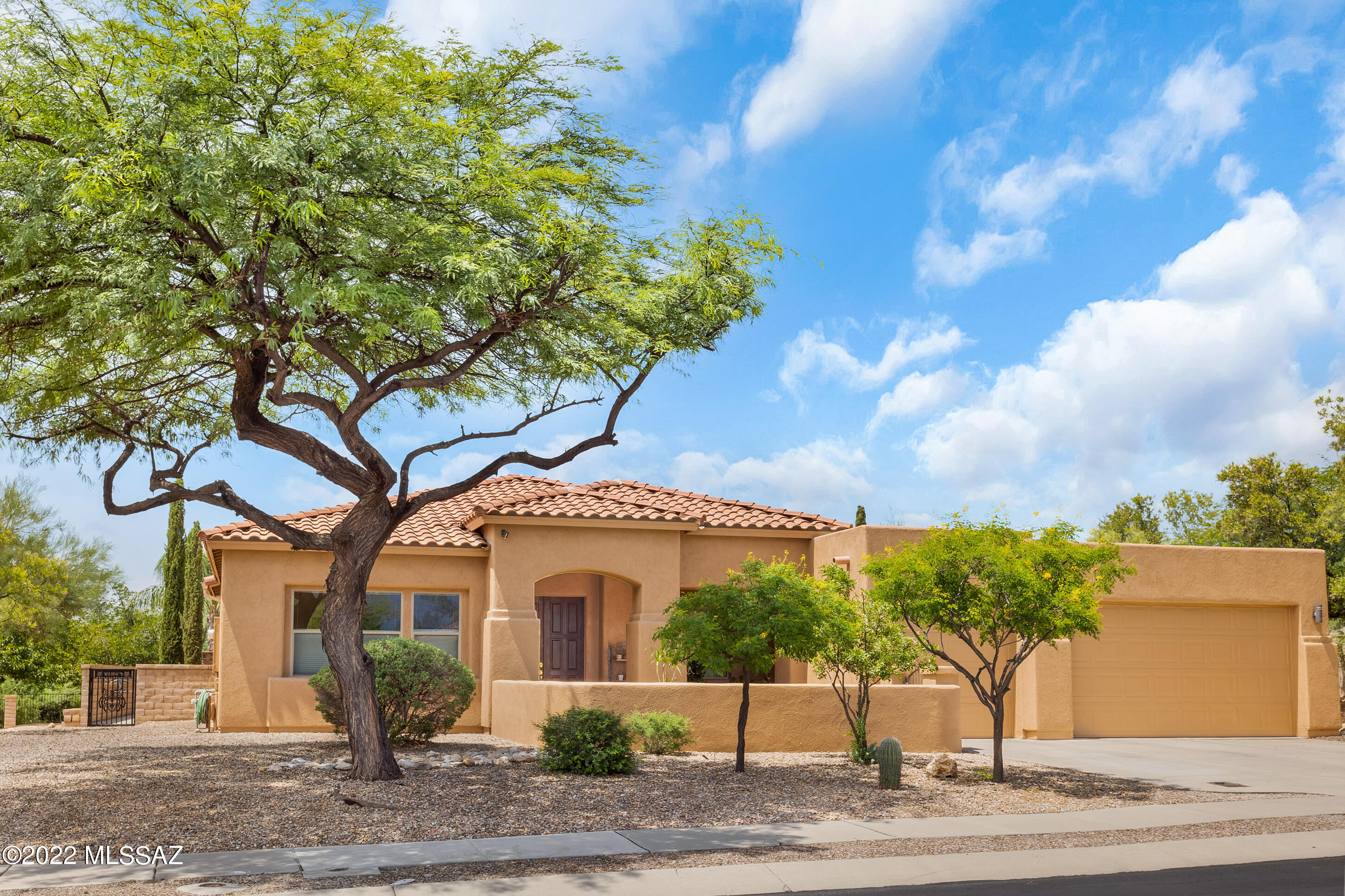 Wonderful four bedroom, three and a half bathroom 2868 square foot home on just under an acre in coveted Vistoso Gateway in the heart of Oro Valley. Open kitchen to great room, plus separate living and dining rooms. Kitchen boasts raised panel solid wood cabinets, granite counter tops, updated stainless steel appliances, gas cook-top, island, roll out shelves and pantry closet. Neutral ceramic tile throughout except newer carpet in primary bedroom and two of the guest suites. High ceilings, open floor plan, wonderful mountain views from living room and dining room. Fabulous rear yard with large custom extended covered patio, outdoor TV area, kitchen with stainless vent hood, fireplace, great for entertaining. Beyond the patio is a terrific elevated spa that spills in to a huge pool. The rear yard also has a large grassy area, fully fenced with wrought iron view fencing. Beyond the fence is additional space groomed in to a cactus garden. Great views of the Tortolita mountains from the covered patio and yard.

Recently painted inside and outside, both HVAC units replaced 2019.

Seller will consider offers in a range between $865,000-895,000.00.