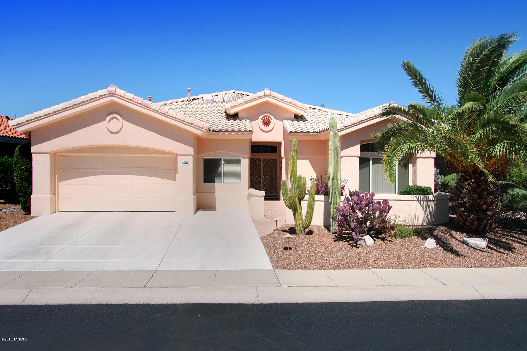 Stunning 2832 sq ft home in an active adult community offering all of the contemporary amenities one would expect. This beautiful and well laid out home has two master suites plus third bedroom and den,  Front entry has double doors and an inviting court yard with mountain views. Expansive, airy kitchen has lots of counter space and is open to a large family room. Both family and living rooms have fireplaces and overlook a back yard that serves as a private retreat, with flagstone patio, Kiva fireplace, gas BBQ island,  and motorized ramada.  Upgrades include gorgeous pecan wood flooring throughout common areas, custom master bathroom with dual sinks and large accessible shower with built-in bench, and newer a/c units. Can be sold furnished