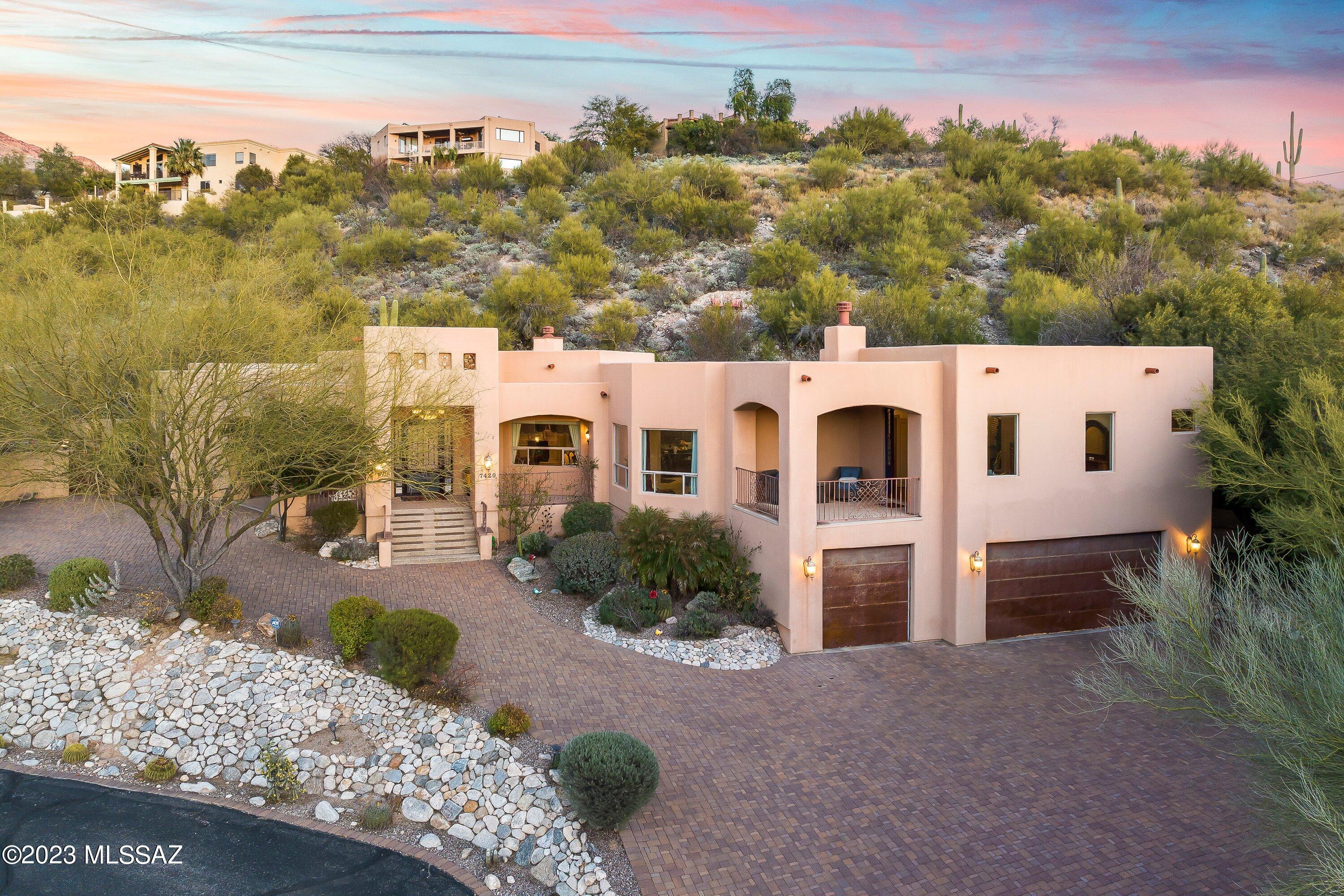 Luxurious Executive home nested in the exclusive Sin Vacas Gated Community of Catalina Foothills. Newer construction with grand ceilings and split bedroom layout. Spacious Kitchen includes High-End stainless steel & copper accented Appliances with luxurious granite tops. You will love the magnificent mountain, city, and sunset views. Huge master suite with walk in closet and private patio. This is an Entertainers Dream Home - Luxurious Canterra Fireplaces, Grand Crystal Chandeliers, Huge Custom Iron Doors that open living spaces to covered patios, full outdoor Kitchen/Barbecue Island & a sparkling pool. Spacious 3 car garage equipped with a 220V connection for your EV charger. Located 2 mins from all amenities at La Encantada Mall & North Oracle Corridor. This is a Must See Foothills Gem!