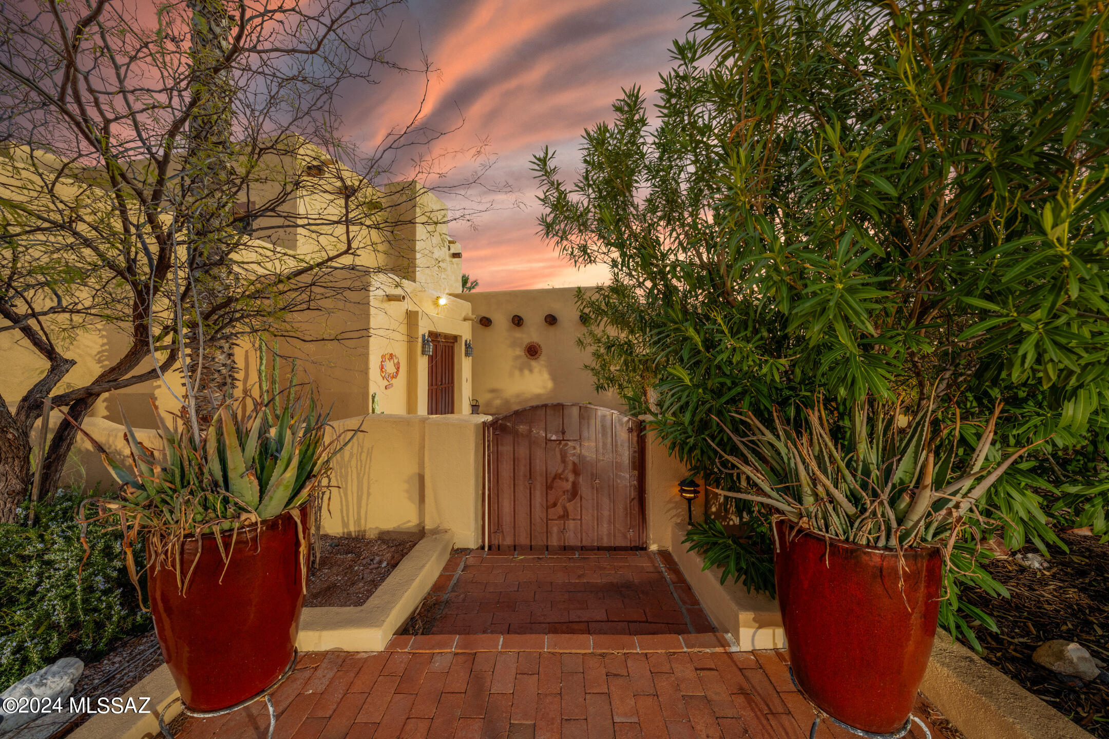 Welcome to a stunning 5-bedroom, 3-bathroom residence that combines comfort and breathtaking views to offer you the perfect dream home.

As you step inside, the exposed wood ceilings with vigas immediately capture your attention, creating a warm and inviting atmosphere. The loft, complete with a balcony, provides a delightful retreat where you can unwind and revel in the captivating views of both the mountains and the vibrant cityscape.

The kitchen features black appliances, a convenient dual oven, and a functional island that enhances both style and functionality. The primary bedroom is a true sanctuary, featuring a beehive wood fireplace that adds a touch of charm and coziness. Two full-length closets provide ample storage, ensuring a clutter-free environment. The attached primary bathroom is a spa-like oasis, with lovely countertops, dual sinks, a luxurious bath, a separate shower, and an additional, generously sized closet.

Step outside, and you'll discover an entertainer's paradise. The extended patio, equipped with a ceiling fan, creates a welcoming outdoor space for gatherings and relaxation. Enjoy grilling and hosting under the Arizona sky with the convenient bar and BBQ grill setup. our next chapter starts here!