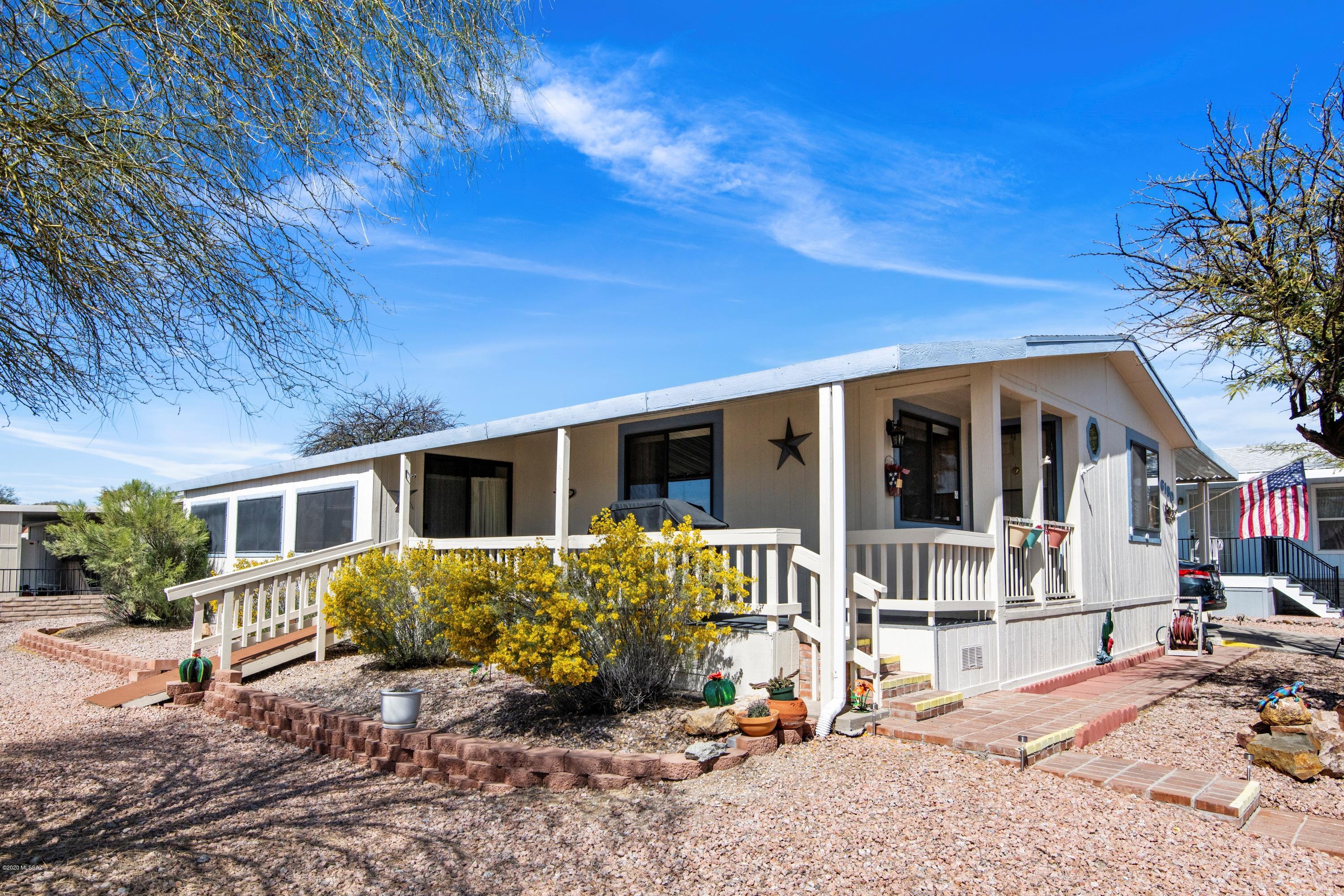 Welcome Home from the minute you walk in! Kitchen walls and cabinets recently painted & new carpet in living room. New ramp offering access from front patio. Outside features large lot, Arizona Room and a 10x12 Work Shop. HOA includes trash, water, sewer, clubhouse, pool, spa, etc. Priced to sell call us to schedule a showing today!