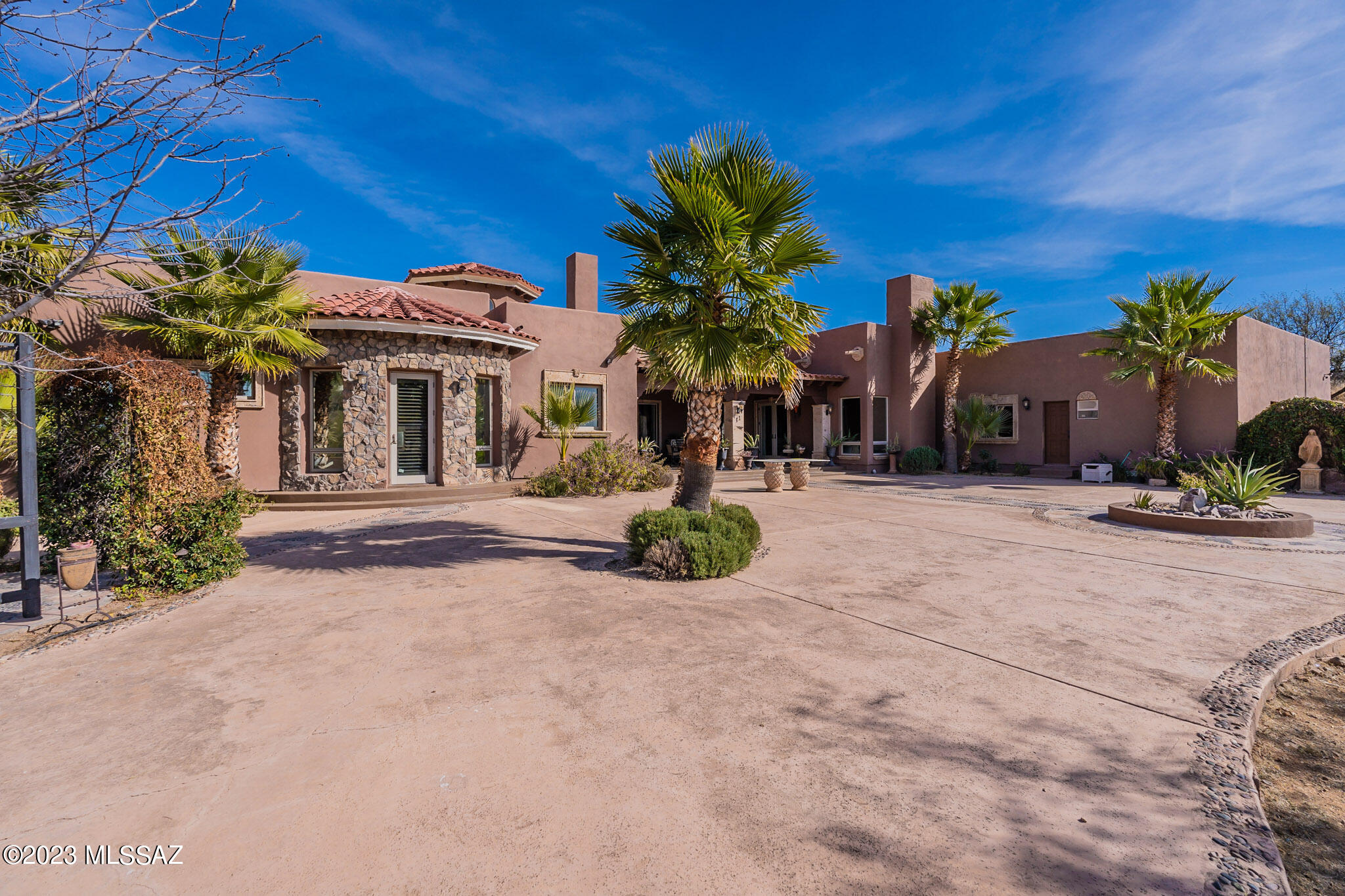 Stunning Ranch style custom home located in Nogales premier neighborhood Camino Vista Del Cielo. This home offers lavish views and privacy. Sitting on more than 5 acres this beauty boasts breathtaking views and an Open floor plan with direct access to the back patio. Perfect for entertaining, sunrise breakfasts, and sunset dinners. Inside you'll find Exquisite Custom Cantera accents throughout, beamed ceilings, sophisticated touches galore. Your own custom built bar, inviting fireplace, Gourmet Kitchen with appliances to match. Perfect for the inspired home chef. Custom designed bedrooms and living spaces. Picture windows provide Beautiful Natural lighting. Definitely a Gem!