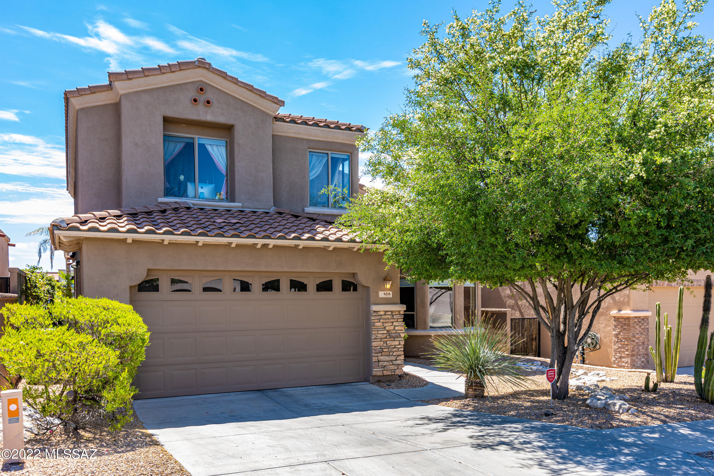 Absolutely exception, updated home with mountain and golf course views! Elegant great room with soaring vaulted ceilings, great entertaining space that flows easily to the back patio for effortless indoor/outdoor living with built in outdoor kitchen, Banco seating, Chiminea fireplace and Hot Tub.  Gourmet kitchen has granite counters and stainless appliances, under-counter lighting, large pantry and dining area . Owners Suite  on main floor with large walk in closet opens to back patio & features a spa like bath with jetted tub and custom closet.  Upstairs are two additional bedrooms as well as an office/den (potentially a 4th Bedroom) Garage has plenty of extra storage space with built in cabinets. Villages of La Paloma golf community offers a manned gate, pool, spa and fitness facilities