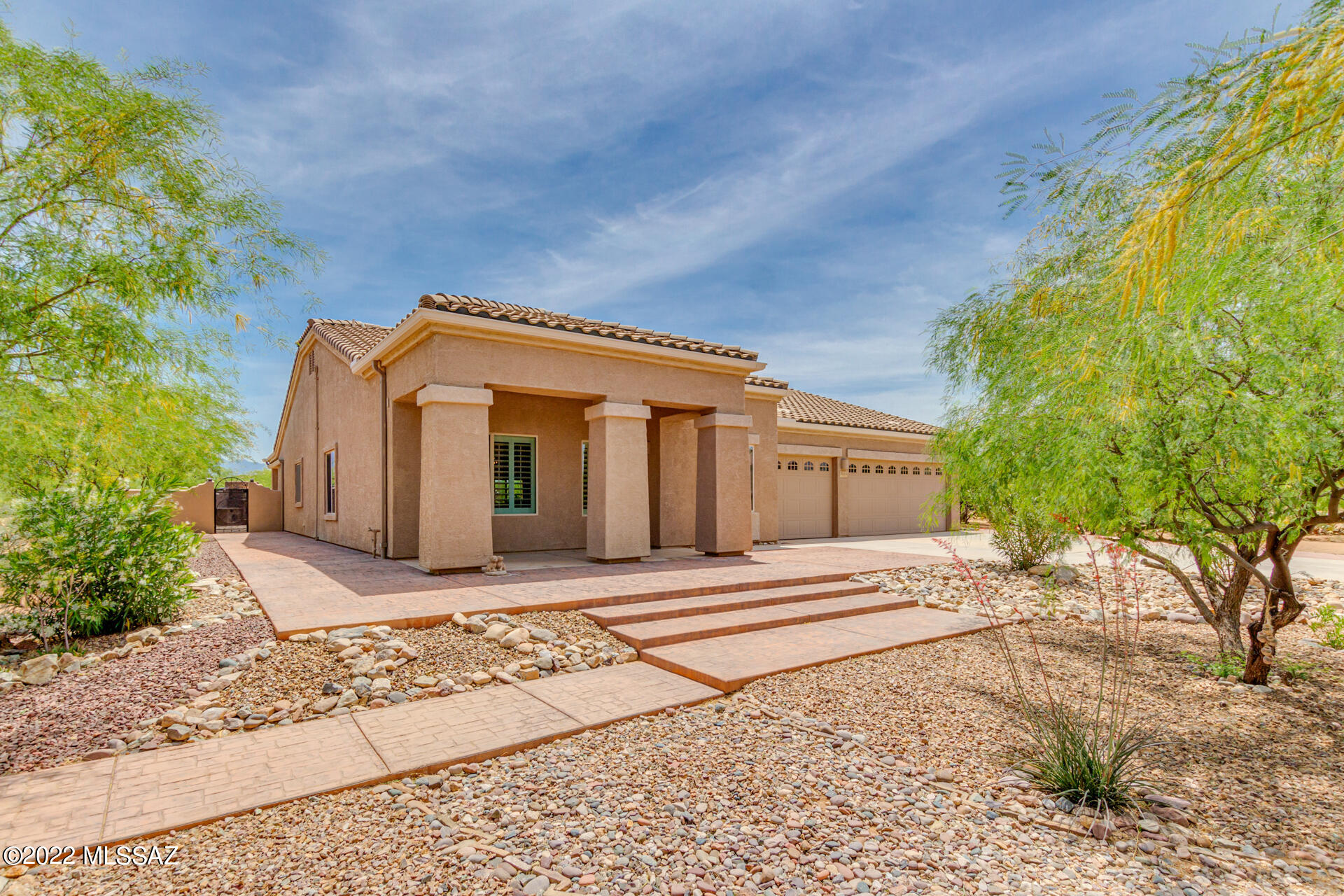 Fall in love in Sahuarita Highlands! This unique property offers exquisite curb appeal with a 3-car garage plus an additional detached 2-car garage that can also be used as a workshop. Nestled on nearly 2 acres of expansive desert landscape w/a circular driveway. 

Come inside to discover a spacious living/dining room, tall vaulted ceilings, stylish tile flooring, custom sheetrock art, plantation shutters, delightful archways, & elegant light fixtures. The bright family room equipped with a gorgeous chandelier opens to the pristine kitchen. The chef's kitchen showcases staggered wood cabinetry with crown molding, granite countertops, a stone veneers wall/backsplash, recessed lighting, & center island w/a breakfast bar.

HOA dues are $129/quarterly.