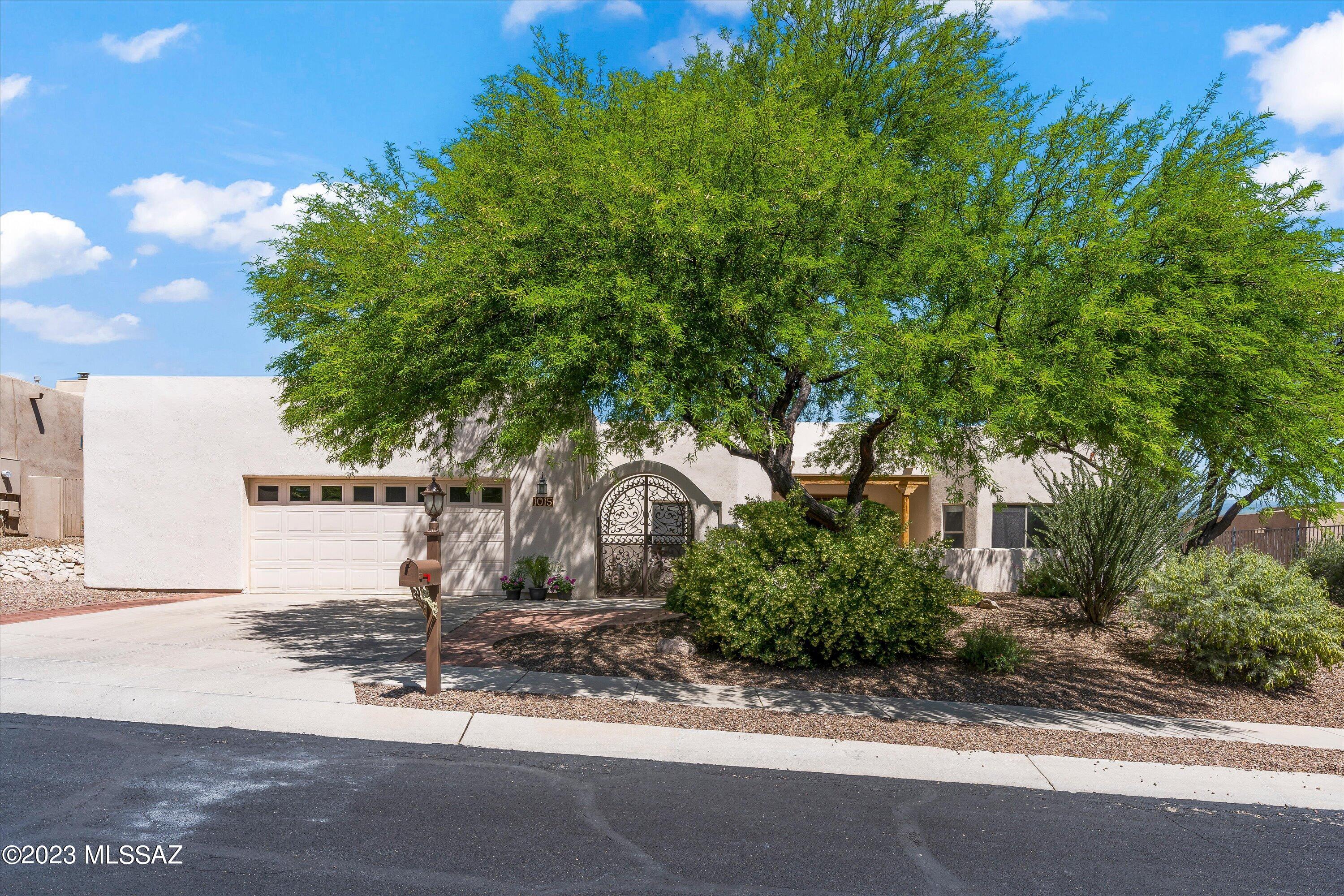 Reduced & ready for you to move in! Through the tranquil courtyard of this gorgeous Tucson Mountain home, find your way inside to experience the inviting natural light & soft vibe this home offers. With four large bedrooms, remodeled two and a half baths and high ceilings throughout, there is plenty of room to enjoy. Now lets talk about the kitchen; custom designed with well thought out cabinets / storage, marble counters, oversized double ovens, large stainless sink, supersized marble island w/ seating for four and a view to the resort style backyard. Enjoy the views of the Catalina Mountains or the millions of shining stars (Tucson Dark Skies) while relaxing in your private pool and hot tub! Looking for that cherry on top? How about new (2022) HVAC's, water heaters & pool equipment!