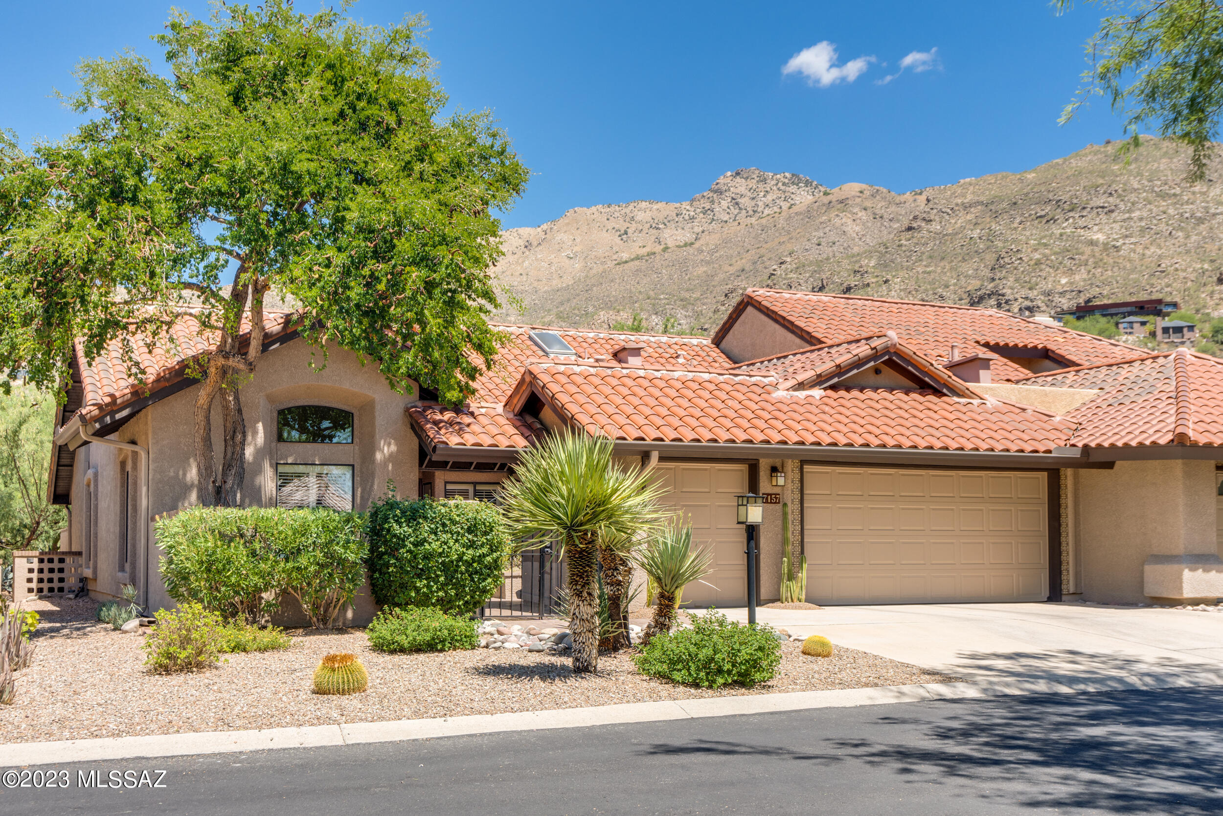 SELLER TO COUNTER OR ACCEPT OFFERS RANGING FROM $775,000-795,000. Welcome to this truly exceptional townhome in Ventana Canyon Lake Estates! No detail was left untouched in this recent remodel. A private courtyard leads you to the modern glass front door. Inside find raised ceilings, neutral paint colors and an abundance of natural light. All new windows finished with Hunter Douglas coverings and wooden shutters. Kitchen is immaculate with granite counters, warm cabinetry, stainless steel appliances, counter height bar, eat-in breakfast nook, and French doors leading to the courtyard. Large dining area is illuminated with  stately chandelier and opens to the cozy living room and refurbished fireplace. The convenient bar with a wine cooler can be easily converted back to a wet bar. Cont'd- Just off of the living room are French doors leading to the large den with back patio access (perfect for an office, library, work out room, or 3rd bedroom). Huge primary bedroom with access to back patio. Fully redesigned primary bathroom with skylight that has a remote controlled shade cover. Primary bathroom has a zero-entry shower for seamless entrance and a separate bathtub. Both bathrooms include Ferguson fixtures and executive height quartz counters. Bedrooms include large custom California Closets. Hallway bathroom has a separate entrance to the guest bedroom to create an ensuite. Stunning private brick back patio backs to golf course, Catalina Mountain views and natural desert landscape. Beautiful tile art by the local artist Carly Quinn conveys. Other features that make this home stand out are the exterior custom chimney cap, Italian roof tiles, newer washer/dryer, laundry sink, ambient lighting, and 3rd garage bay for golf cart. Ventana Canyon is a highly sought after Catalina Foothills community. Resort living at its finest with the world renowned Tom Fazio designed golf course, pickleball and tennis courts, exquisite dining, work out facilities, pools/spa, and more...all available by separate membership.