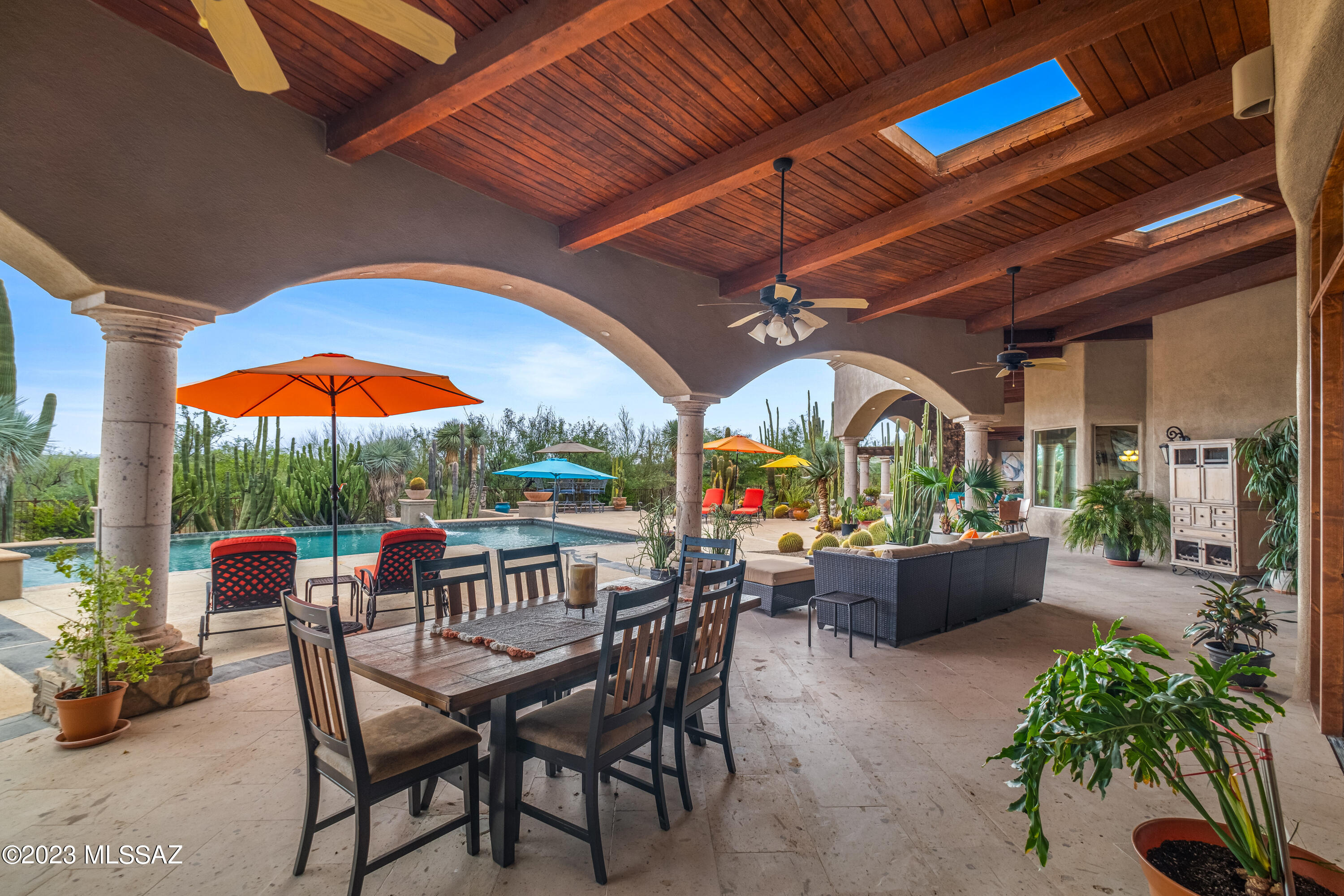 Enchanting and Inviting Spanish Colonial Estate inspired by the Royal Palms Resort & Spa in Phoenix.  The infamous design team consisted of Builder Al LeCocq, Architect Greg Simmons, Engineer Bruce Kelly, Designers Susan and Tom Lujan and Sandra Kenney, and Luxurious Landscape Designer Tom Black.  The home was designed with a 360-degree advantage of the mountains, city and majestic saguaros that surround the property.  This estate was featured in the Tucson Lifestyle and Phoenix Home and Garden Magazines due to its splendor, privacy and tranquility.  There are views from every window and a private patio and ensuite bath at each bedroom.  9,000+ square feet of indoor/outdoor living areas.  Heated Pool w/Lagoon and waterfall features, fire bowls, an 8-person spa, and an outdoor kitchen. The front courtyard of your dreams with lush landscaping and a grand four-tiered Cantera stone fountain.  The interior is full of warmth, color and texture from the reclaimed barn wood and tumbled travertine floors, barrel vault ceilings, wood beam ceilings, 8' Alder Doors, decorative ironwork, Cantera Columns, and 5 gorgeous fireplaces.  Owner's Suite features a private outdoor area with fountain and outdoor shower, a Spa Bath including Thermal Masseuse Tub and separate walk-in shower, sitting area, and custom walk-in closet with safe and island with granite countertop.  Chef Inspired Gourmet Kitchen with a lovely end grain teak counter island and prep sink, Dacor and Subzero appliances, farm sink, and the beautiful floors weave reclaimed barn wood and tumbled travertine to form a piece of art.  Too many amazing features to list here.  See the List of Custom Features in the Documents tab.
