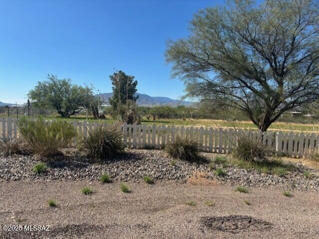 Large fenced lot (.55 acre) with septic in place. Water and electric at lot line. Flat usable land with great views and close enough to I-10 for easy commute, but far from highway noise. Build or bring your dream home here.