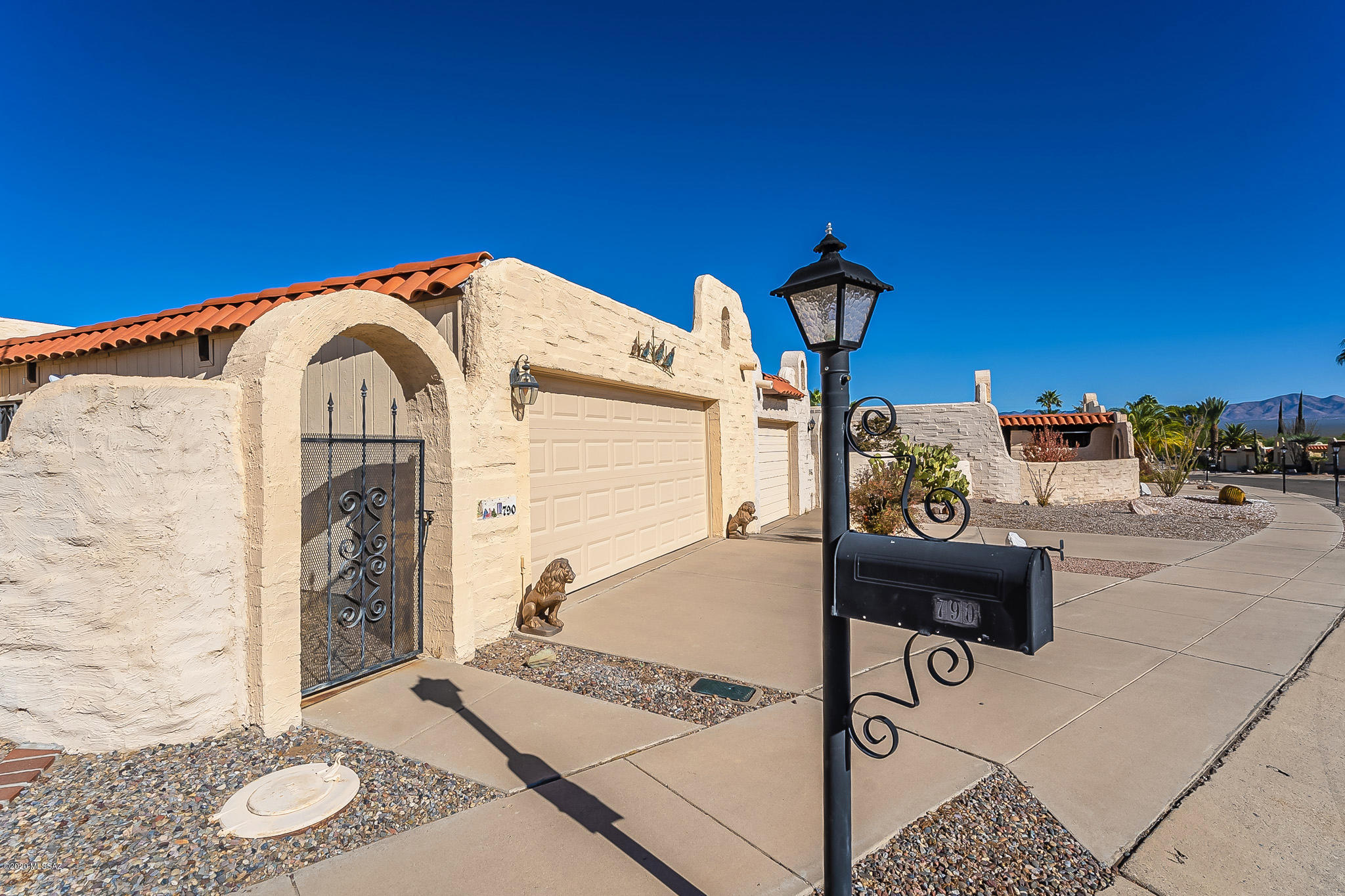 Beautiful, well maintained home in Esperanza Estates. GVR is available but not required.  The backyard is landscaped with mature citrus trees and backs up to an easement with a nice trail for walking pets.  There is a large, shaded back patio for enjoying the Arizona weather!  Garage is large enough to accommodate oversized vehicles.  The owner of this unit has enclosed the garage and added a security door making this one of the only units in the neighborhood with this feature.  Front courtyard enjoys wonderful views of the Santa Rita mountains.  This property is being sold fully furnished.  Schedule a showing before it is gone!