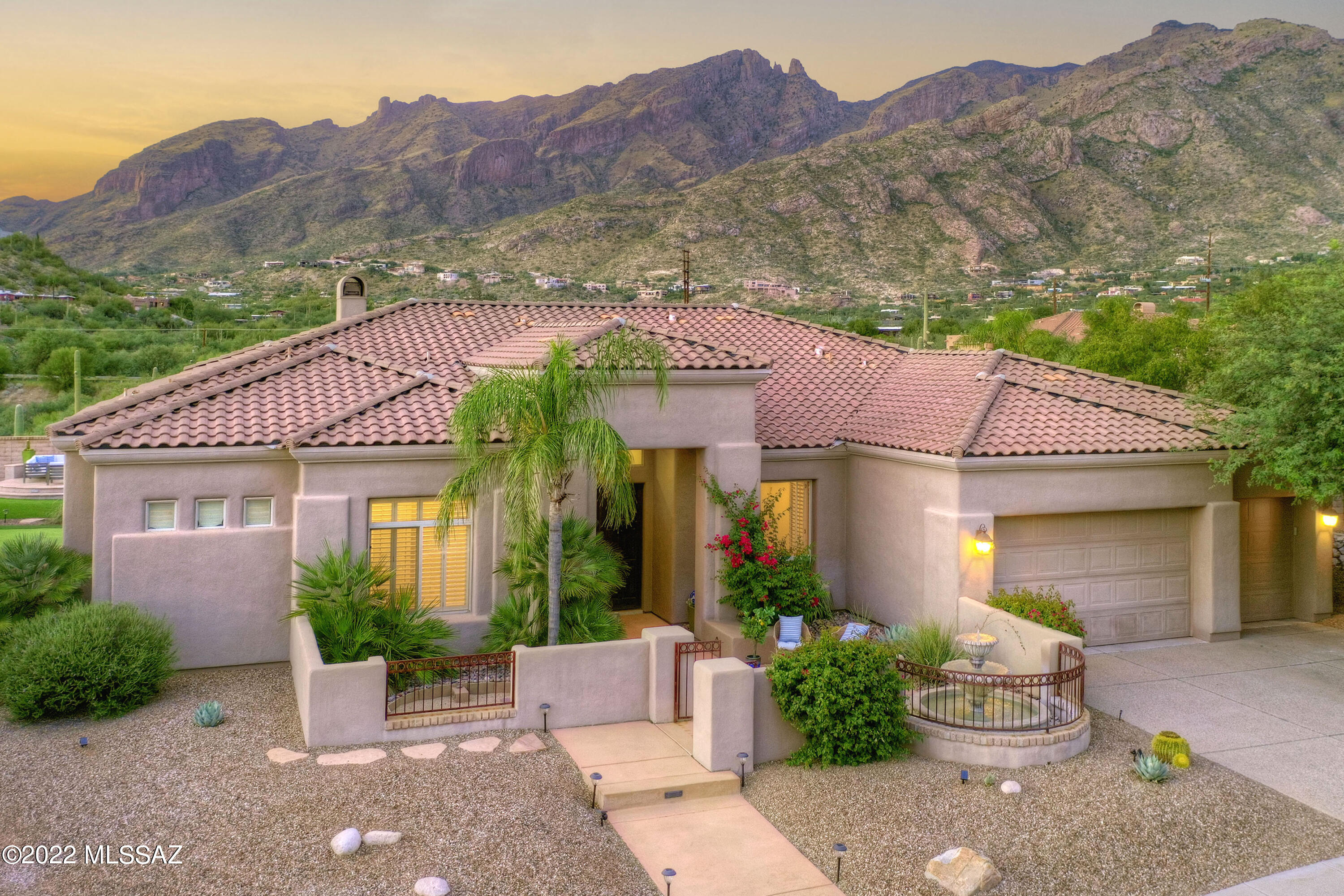 Stunning soft contemporary w/ magnificent mountain views in prestigious gated Pinnacle Ridge.  A lovely front gated courtyard w/ sparkling fountain invites you into this exceptional home with 3,130 sqft, exquisite Greatroom w/dramatic  fireplace, high ceilings, walls of picture windows, formal dining room, beautiful wood floors, gourmet island kitchen w/ granite countertops, gas stove top, refrigerator, built-in desk, pantry, large breakfast area, 3 bedrooms plus study or 4 bedrooms, 3 baths, spacious master w/sitting area, luxurious bath, large walk in closet & private entry to rear patio. Enjoy fabulous large backyard with covered flagstone patio, pool, spa, artificial turf, putting green, basketball court, built-in BBQ, lush landscaping, 3 car garage, Dist16 schls & views, views, views.