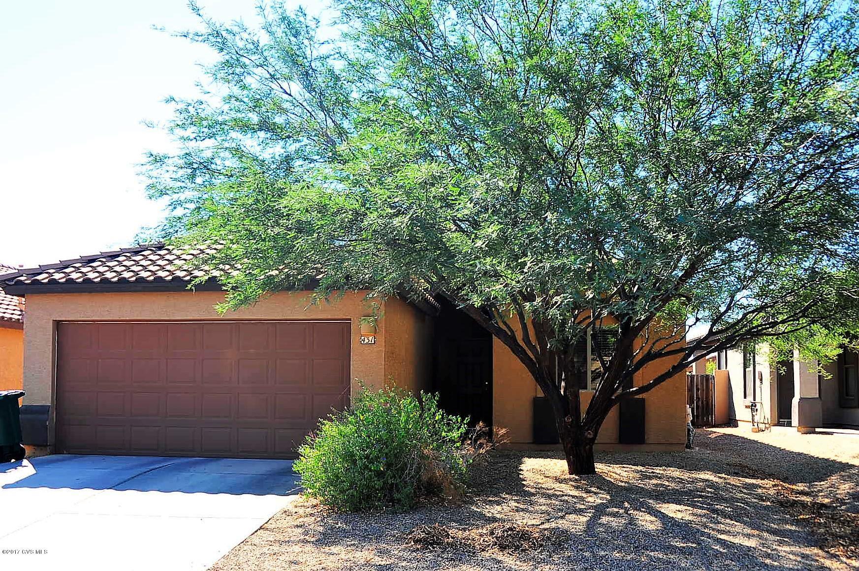 3rd Bedroom is converted Den, can have it either way. CHARMING BRIGHT 2 BEDROOM 2 BATH HOUSE WITH DEN ADJACENT TO LIVING ROOM. HIGH CEILINGS CREATE A LIGHT AND AIRY SPACE WHILE WALL SHELF AND ARCHES ACCENT THE MAIN ROOM WITH A CLEAN & CRISP LOOK. SPLIT BEDROOM FLOOR PLAN MAKE FOR PRIVACY FOR GUESTS OR CHILDREN. BEAUTIFULLY SHADED BACK YARD COURTYARD HELPS COOL THE AFTERNOON SUN. HOA INCLUDES CLUB HOUSE, WATER PARK, 3 POOLS, SPA EXERCISE CLASSES, GYM, KID CLUB, MINI GOLF, TENNIS, VOLLEYBALL, BASKETBALL, WALKING/BIKE PATHS. SAHUARITA LAKE, FISHING, DOG PARK & FREE COMMUNITY EVENTS.