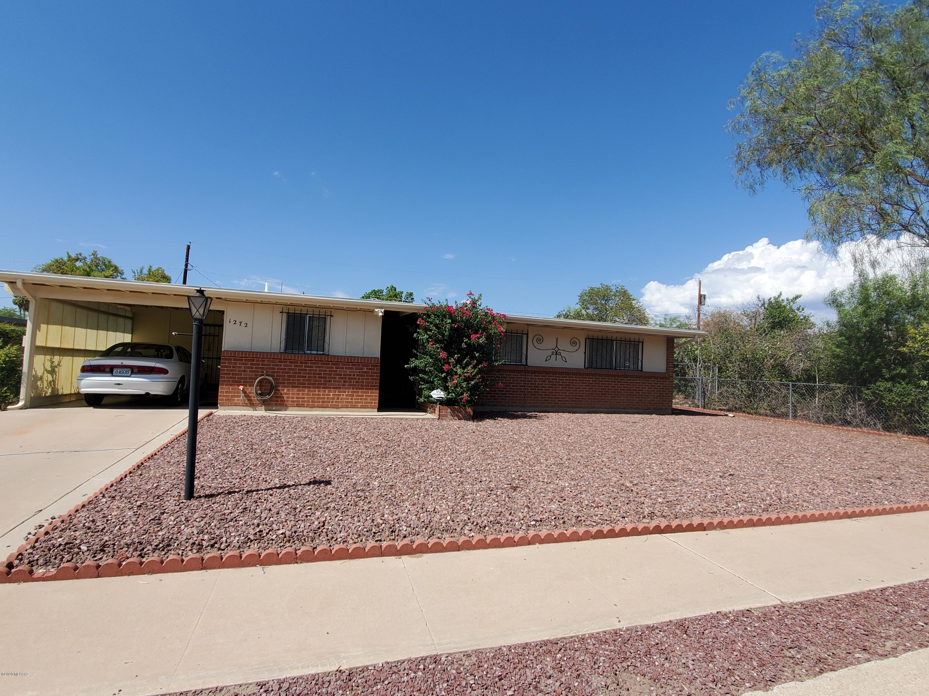 Well maintained Charming home in a Super Central Area! Ideal Proximity to I-10, minutes from Downtown, and U of A walking to High school.  This Property will make a Great family home/Investment/Rental. 3 bedroom,2 bathrooms with powder room, Wrought Iron throughout, the furnace and HVAC system are approximate. 1 year new.  Featuring Low care landscape with new gravel in the front. The large back yard is ready for the new owner's touches,  including an Arizona room and storage shed. Great neighbors Schedule your private tour today!
