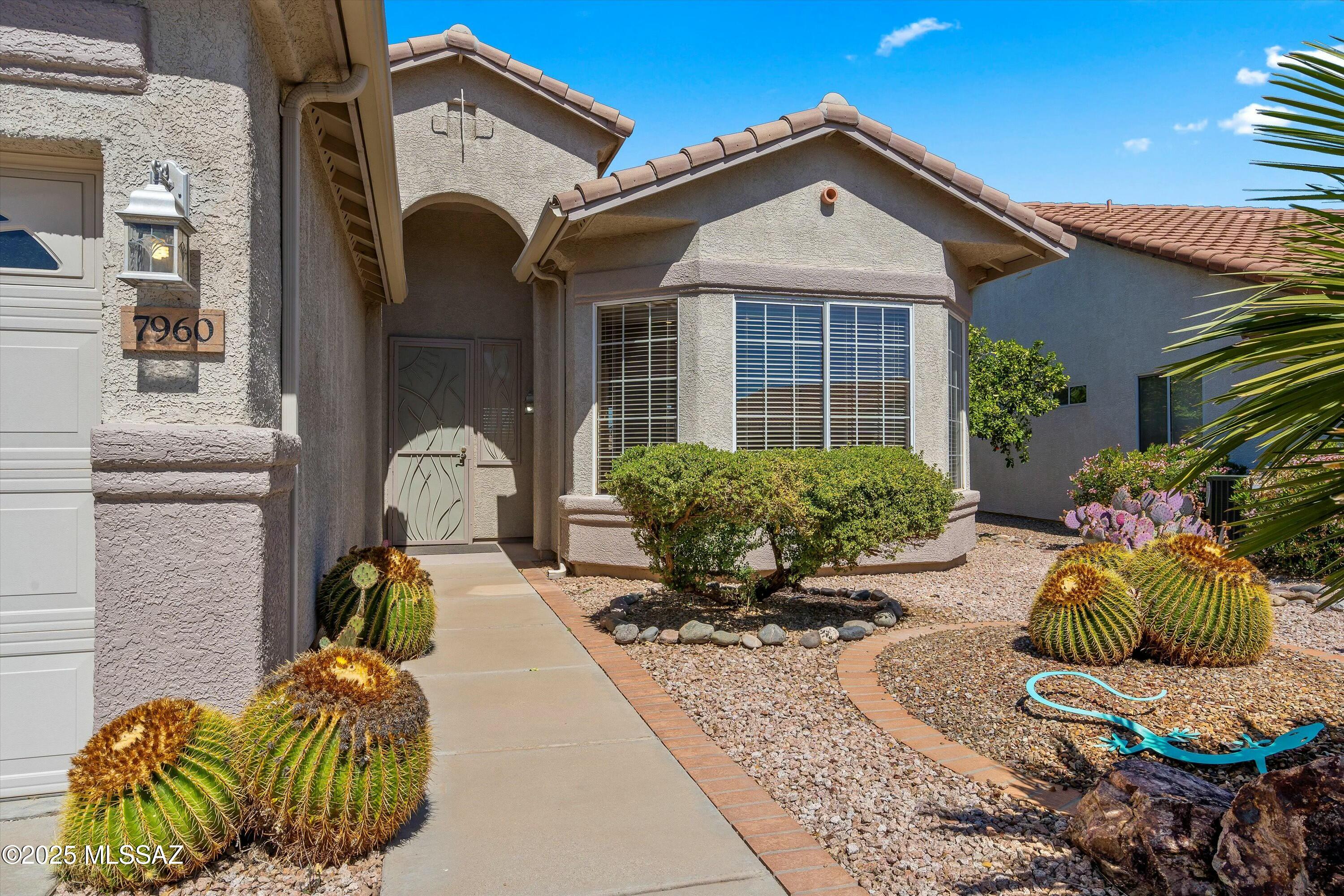 Welcome to this lovely Kachina model home, offering 1,972 sq ft of thoughtfully designed living space with 2BR / 2BA, a den, and a 3-car garage. Step inside to an inviting open-concept living and dining area, where a wall of windows floods the space with natural light. Spacious kitchen, featuring S/S appliances, a breakfast bar, nook, and prep island for convenience. Large primary bedroom with en-suite, step-in shower and California walk-in closet. Guest bedroom features additional storage and is located near the guest bath. The den provides a space for projects or relaxing. Nestled in a serene setting with brilliant mountain views, this home backs up to a peaceful common area providing privacy and a true desert connection. All appliances convey.