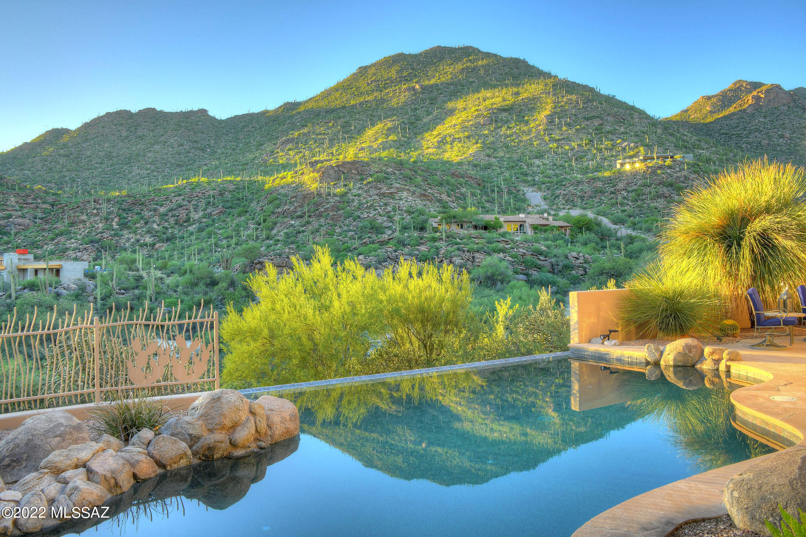 *BEST DEAL* IN CANYON PASSS! HUGE REDUCTION!!  NEW HOME OF ''LIV'' GOLF TOURNAMENT! SW CONTEMP NESTLED ON RIDGE W/BREATHTAKING VIEWS & MTN VISTAS! AMAZING ESTATE ON HILLSIDE OVERLOOKING LUSH SONORAN DESERT, DRAMATIC VEGETATION, SOARING SAGUAROS & BRILLANT SUNSET/HORZON VIEWS...TO SOMBRERO PEAK! CASUAL LIVING AT ITS BEST- SEAMLESS TRANSITION TO OUTDOORS- TONS OF WINDOWS/GLASS THRU OUT- BRINGS THE BEAUTY OF THE DESERT  INTO YOUR HEART! FILLED W/JEWELS...INCREDIBLE MEDIA RM, HOME OFFICE- DUAL DESK AREAS, GATHERING RM, SPECIAL DINING EXPERIENCE- CITY LIGHTS VIEWS...PLUS ''FLEX'' FAMILY RM OFF THE GOURMET KIT! PRIMARY RETREAT BOASTS SUNSET PATIO, SOAKING TUB & OVERSIZED SHOWER! MAKE THIS YOUR VACATION GETAWAY/OR LUXURY RENTAL...GOLF/ HIKE/BIKE,FITNESS CTR...ENJOY LIFE ON DOVE MTN- JUST MOVE IN