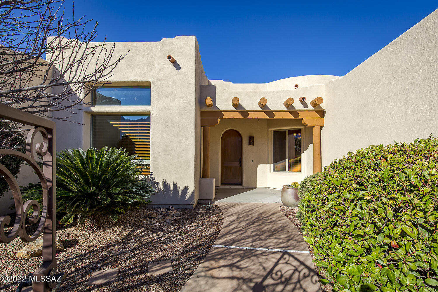This stunning 4BD/3BA house is nestled in a beautiful, gated community within Oro Valley. With this open floor plan and abundant natural light, it will always feel cheery at home. The kitchen is sizable and comes with hickory cabinets, granite countertops, stainless steel appliances, a double oven, and a breakfast bar. The master bedroom has a view of Pusch Ridge Mtn. while the master bath comes with split sinks, 2 walk-in closets, and slate tile walls. From the backyard, you have an overlook of the wash and beautiful Tortolita Mtn. sunsets. Relax in a cool pool during the hot summer months and warm up by the fireplace in the winter. This home is conveniently located near parks, shopping, grocery, health care, and entertainment.