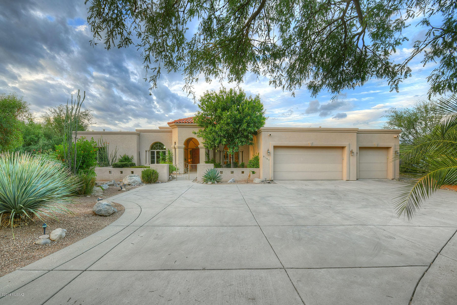 STUNNING SOFT CONTEMPORARY W/MT. & SUNSET VIEWS IN PRESTIGIOUS GATED VENTANA CANYON. FRONT GATED COURTYARD,  EXQUISITE LIVING RM W/ DRAMATIC 18 FT. HIGH CEILINGS, ELEGANT  FIREPLACE, LG  PICTURE WINDOWS , FORMAL DINING RM, GOURMET ISLAND KIT  W/GRANITE COUNTERTOPS, STAINLESS STEEL DACOR GAS STOVE TOP, OVEN , ASKO DISHWASHER, 
REFRIGERATOR, PANTRY,  BREAKFAST AREA, FAMILY RM W/TILED FIREPLACE, BEAUTIFUL TRAVERTINE TILE FLRS, 4 BR'S  SPLIT PLAN + STUDY (OR 5 BEDROOMS), 4 BATHS, MASTER SUITE W/SITTING AREA, FIREPLACE , LUX  BATH W/DESIGNER TILE COUNTERTOPS, DBLE SINKS, JACUZZI  TUB,  SHOWER, LG WALK IN CLOSET & PRIV ENTRY TO  REAR PATIO. ENJOY  SERENE BKYD  W/LUSH LANDSCAPING, COV'D PATIO,  WATER FEATURE , BBQ, 3 CAR GARAGE &  DIST.16 SCHOOLS. FLR PLN UNDER PHOTOS, VIRTUAL TOUR.