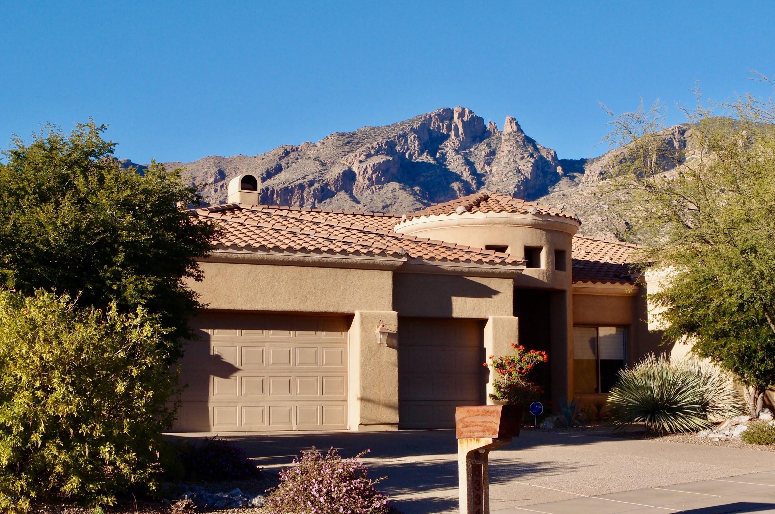 This lovely AF Sterling 3541 sq ft home is the only home for sale in the gated community of Paloma Canyon/Pinnacle Ridge. Magnificent Catalina Mountain views throughout the home and back yard.  Open concept floor plan, with formal living room with high ceilings and oversized windows, formal dining room, large breakfast area, family room.  The kitchen features granite counter tops and stainless steel appliances.  Spacious Master suite with dual vanities and closets, garden tub and walk in shower.  Split bedroom plan, with 3 additional bedrooms, 2 share Jack and Jill bathroom.  Spa and 38 foot pool, great for swimming and exercise. Built in BBQ and fridge, ready for entertaining. 3 car garage. District 16 schools. Level lot and no inside steps. Priced below recent comps and move in ready!!!