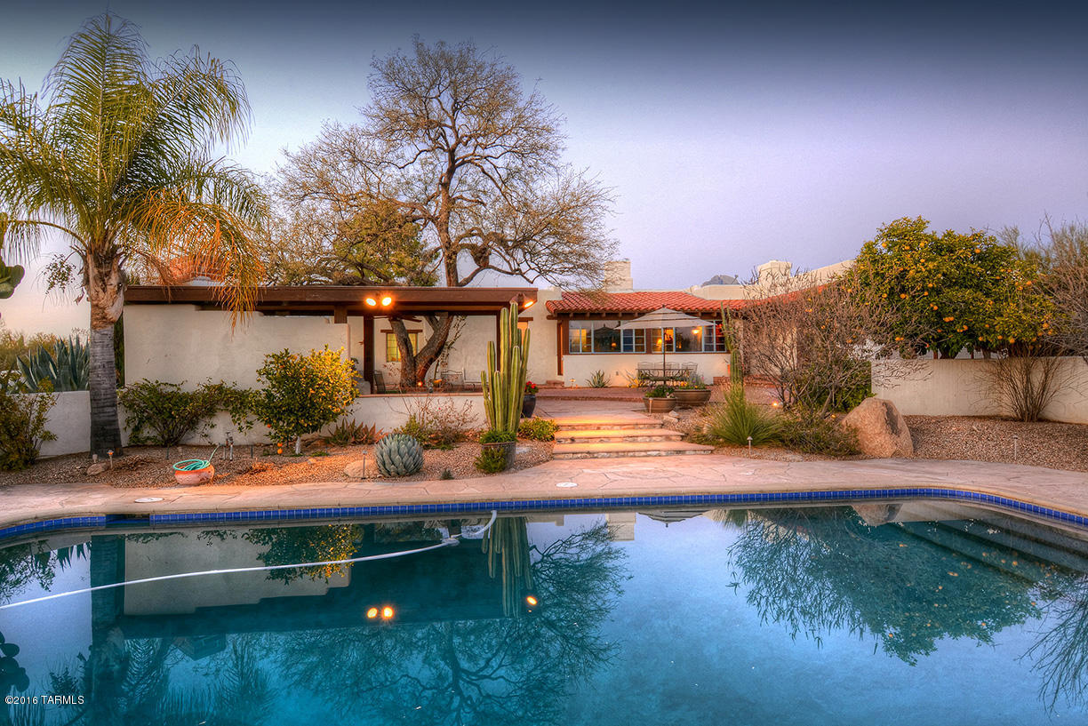 Offering the gracious lifestyle of a bygone era with courtyards, fountains & wonderful mountain views, this authentic Joesler foothills home was constructed during Tucson’s romantic Spanish Colonial Revival period of the early 20th century & features the details & techniques that only a true Joesler can provide. Inside you will find stunning hand-hewn beamed ceilings & doors, multiple fireplaces, large windows framing the views & beautiful Talavera tile. Formal living & dining rooms w/sweeping Catalina views & a spacious yet comfortable family room looking out to the sensational backyard w/sparkling pool, covered patios, expansive hardscaping & a spacious ramada w/built in BBQ & fireplace for the ultimate in outdoor entertaining. This is the timeless classic home you have been waiting fo