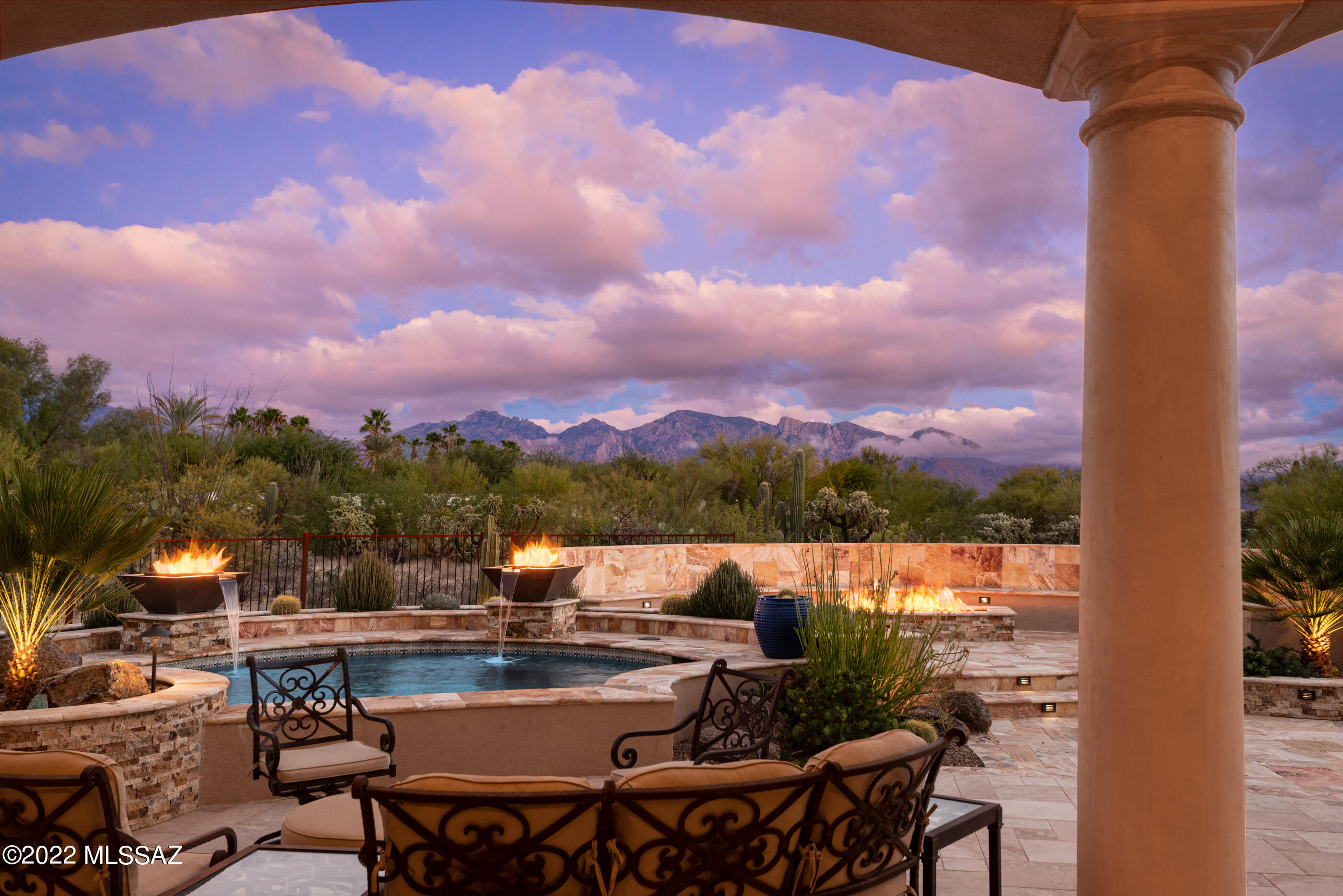 Pilot's Dream Property at La Cholla Airpark; 3,497sf 3BR/4.5BA incredibly amazing single story home w/unobstructed Catalina Mountains views, Spool, 3 car-garage & 3,338sf hangar on 8 acres in the heart of Oro Valley. The open floor plan & inviting outdoor living space w/built-in seating are perfect for entertaining a large group or small intimate gathering. Kitchen has 17' island w/raised curved breakfast bar, stainless appliances. The dining area has rounded coffered ceiling, distressed buffet w/granite counters, travertine backsplash & hutch w/plate rack. Beautiful Travertine tile w/Versailles pattern adds to the comfortable elegance. Fabulous master suite has huge walk-in closet & his/her baths. Incredible observation deck from the roof deck Pergola.