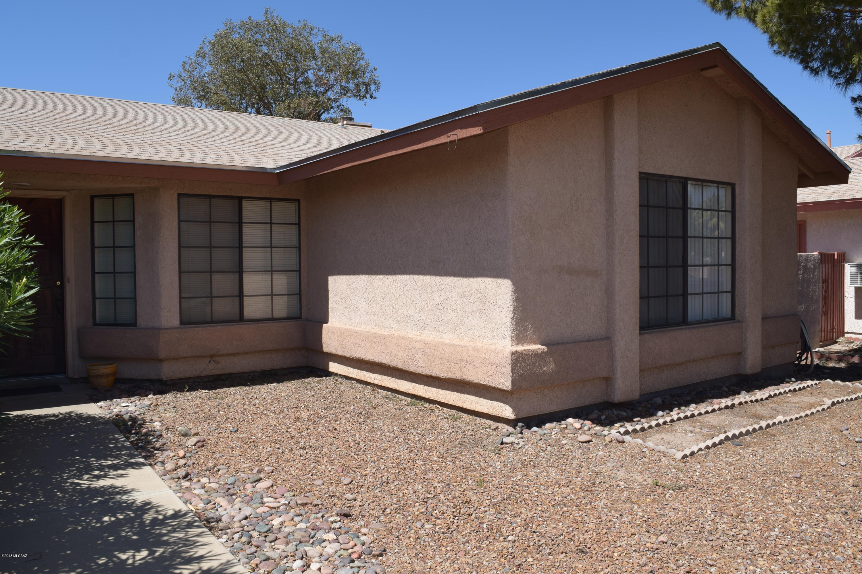 Seller will accept or counter offers between $185,000-$195,000. Quaint Midvale Park home full of potential.  Plenty of storage in kitchen with Newer gas range and newer ceramic tile! Lots of living space with fireplace in the family room. Large master suite, split floor plan, lots of closet space!! Great location close to freeway access, shopping, dining, entertainment, and walking distance to Pima Community College Desert Vista Campus! Currently being rented month to month, Move In or Buy it as an Investment Property! This Is A Must See!