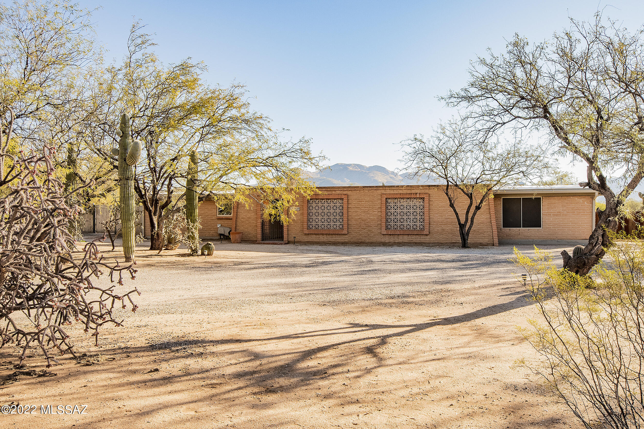 Range price listing, seller will accept or counter offers within the range of $895,000 - $975,000. Wow is all you can say to the wonderful upgrades added to this home. Great 2848 square foot home newly updated kitchen, open great room with beehive fireplace, home office, master suite and bath with Hydrotherapy bath with lights. The home has a separate guest quarter attached with separate entrance, good for office, bedroom exercise room, or storage. The private guest home has  800 square feet of perfection, upgraded galore. Did we mention the four car detached garage/workshop, insulated, new items include electrical, drywall, insulated, plumbing and new septic system for guest house. Private location, 1.3 acres, mountain views, amazing night skies. The 800 square foot guest house is a must see , no detail was missed . Concrete floors , quartz counter tops , fire place insert , washer dryer , induction cooktop , two mini splits for heating and cooling , just to name a few of the upgrades . Very private from the main house , beautiful mountain views , a must see . Completely fenced back yard area . Wonderful mountain views , easy drive to Mount Lemmon , Agua Caliente Park , Saguaro National Park or Sabino Canyon for days of fun . This is a one of a kind of your private paradise . Will sell quickly , show today .