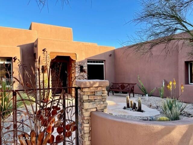 Gorgeous custom home on 7.5 acre view lot in desirable La Cholla Airpark with amazing Catalina Mountains views out most windows!  The home is appointed with high end features such as courtyard entry w/fountain, long paver brick driveway, Alderwood doors, granite countertops, travertine/wood flooring.   3 bedrooms w/outside access to your resort like backyard with outdoor kitchen, sitting area w/fireplace overlooking amazing mnt views. Fabulous horse facilities with a ''tack room or man cave''.  Spacious office with fireplace. Large master suite with sitting area overlooking the pool/spa and mnt views. master closet w/built-ins.  Lovely bar area off dining room. Outdoor Kitchen...  Airplanes or Horses or Just want an amazing custom with Views, This house provides all!