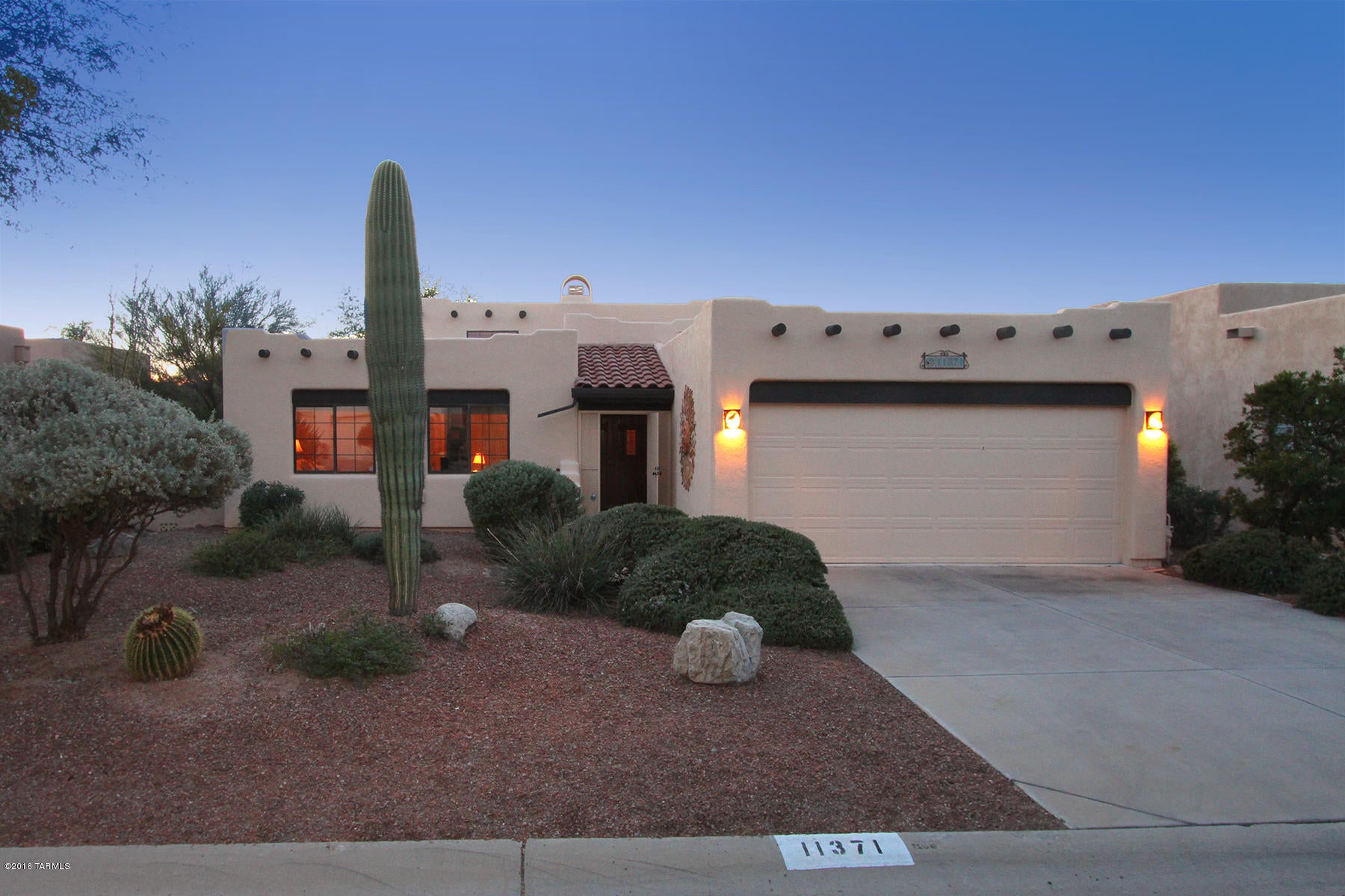 Nestled within the homes of Canada Hills Village in Oro Valley is a beautiful Santa Fe styled home.  Charming, character, and pristine is the best way to describe 11371 N Scioto Avenue.  Even the beautiful street is immaculate, filled with friendly neighbors and mature vegetation; a walkers paradise.  The home is 1,637 sq ft, 3 bedrooms, 2 baths, FULLY FURNISHED and appointed with exquisite taste.  There is a formal dining room, living room with beehive fireplace, high ceilings, Saltillo tile and new wood floors in the bedrooms.  The patio features a gas grill, patio furniture, mature plantings and sunset views.  A beautifully appointed kitchen with all new appliances rounds out this magnificent property.  Walk to the country club, restaurants, even a walking/jogging path and so much more.