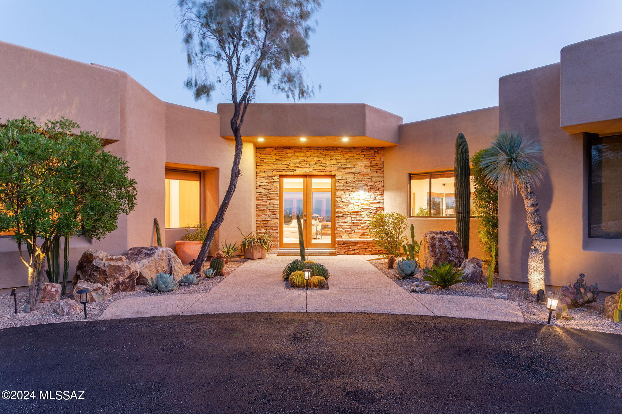 Custom designed & built for the single owner, this serene retreat offers sophisticated comfort for modern living. The open floor plan features high ceilings & expansive windows flooding the interiors with natural light and showcasing breathtaking city views. Gourmet kitchen, luxurious primary bedroom suite with steam shower & adjacent den, second bedroom suite with private access to back patios, 24x24 inch Turkish Travertine floors throughout, view deck and much more. Inviting outdoor spaces designed for relaxation & entertainment are meticulously landscaped and offer panoramic city, mountain, sunrise & sunset views! Easy access to upscale shopping, dinning & recreational opportunities. offered by owner/broker.