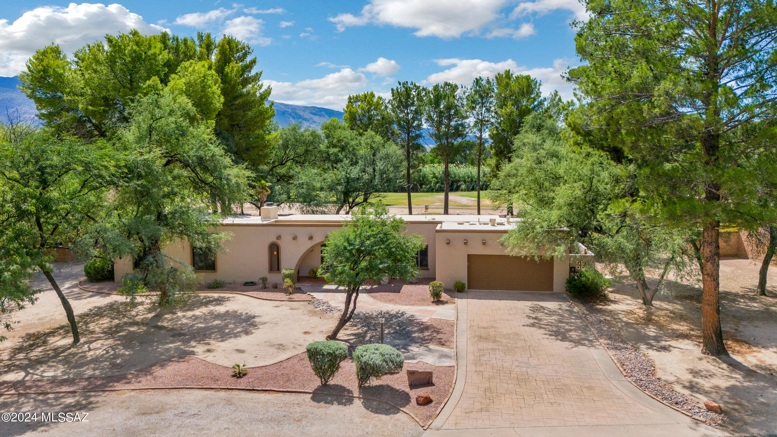 Look no further! Gracious split 4 BR/  3 BA home that backs the 6th fairway.
Magnificent golf course and mountain views from gorgeous remodeled home in Forty Niners Country Club. Fluid design with huge picture windows that frame the the forever views throughout. Living room features wood beams, distinctive stone fireplace and thoughtfully opens to incorporate the kitchen. Cook's kitchen boasts breakfast bar,eat in nook, bountiful solid cabinetry, solid surface counters, newer SS appliances, graphite sink and tile backsplash. Master suite offers niche lighting, updated dual sink vanity and large walk in shower & private patio. Exceptional backyard with sweeping covered patio, refreshing pebble finish pool, grass and mature trees in a park like setting. Oversized 2 car garage plus workshop
