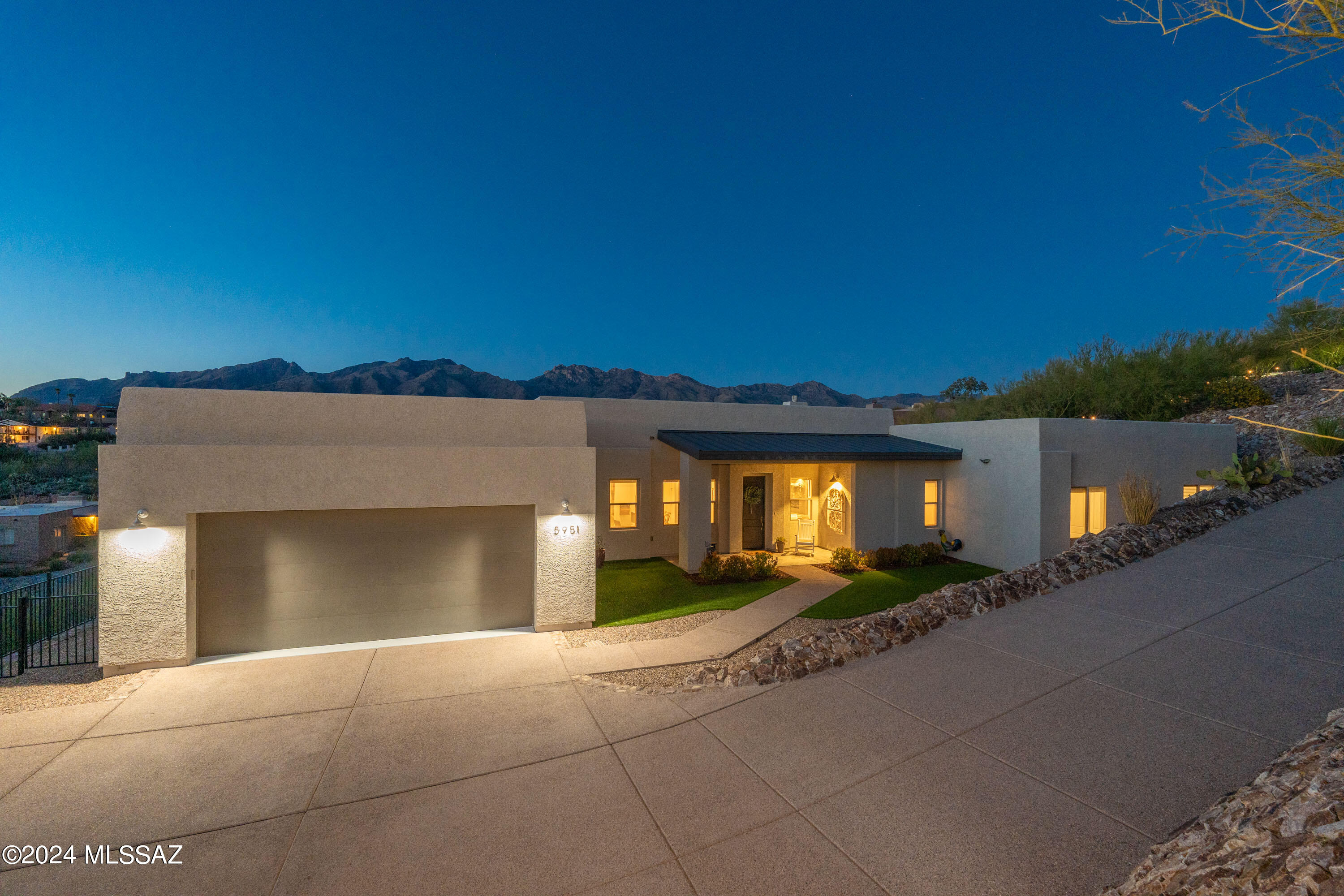 Nearly 1 acre with custom home.  4 bdrm 2 1/2 bth plus bonus room & pocket office.  Many upgrades throughout including wet bar, gas linear fireplace, walk-in shower and walk-in pantry.  Open concept design connects living spaces.  Cul-de-sac.  Home was built in 2018.   Unobstructed views of the Catalina Mountains.  Very private.  Swimming pool. Turf and beautiful rockwork in front and back yard.  Seller is related to listing agent