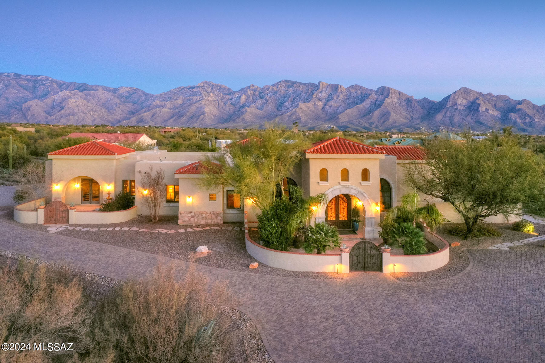 THIS IS AN ABSOLUTELY AMAZING PROPERTY! MAGNIFICENT MEDITERRANEAN STYLE 6 BEDROOMS/ 4.5 BATHS PLUS GUEST CASITA/BATH & OFFICE SITS ON A 3.4 ACRE LOT WITH LOVELY MOUNTAIN VIEWS. HOME BOASTS AN INCREDIBLE BRICK BOVEDA CEILING & CUSTOM DESIGNED MARBLE MEDALION IN MAIN ENTRY FOYER, SOLID ALDER WOOD DOORS & CABINETRY, NUTONE CENTRAL VAC & INTERCOM SYSTEM, 18 MEXICAN CARVED CANTERA STONE COLUMNS, LOWEN & WINDSOR WINDOWS, FABULOUS CHEF'S KITCHEN W/ BUTLER'S PANTRY, SPACIOUS ENTERTAINMENT ROOM W/ 2 WAY FIREPLACE & BUILT-IN BAR PLUS AN INTERIOR COURTYARD W/ CANTERA FOUNTAIN. ATTACHED CASITA W/ OFFICE HAS ITS OWN ENTRANCE & MAKES A PERFECT SEPARATE GUEST SUITE. EAST FACING OASIS LIKE BACK YARD HAS A PRIVATE VIEWING DECK, MATURE FRUIT TREES, PUTTING GREEN, CUSTOM FIRE PIT & DELUXE POOL & SPA!