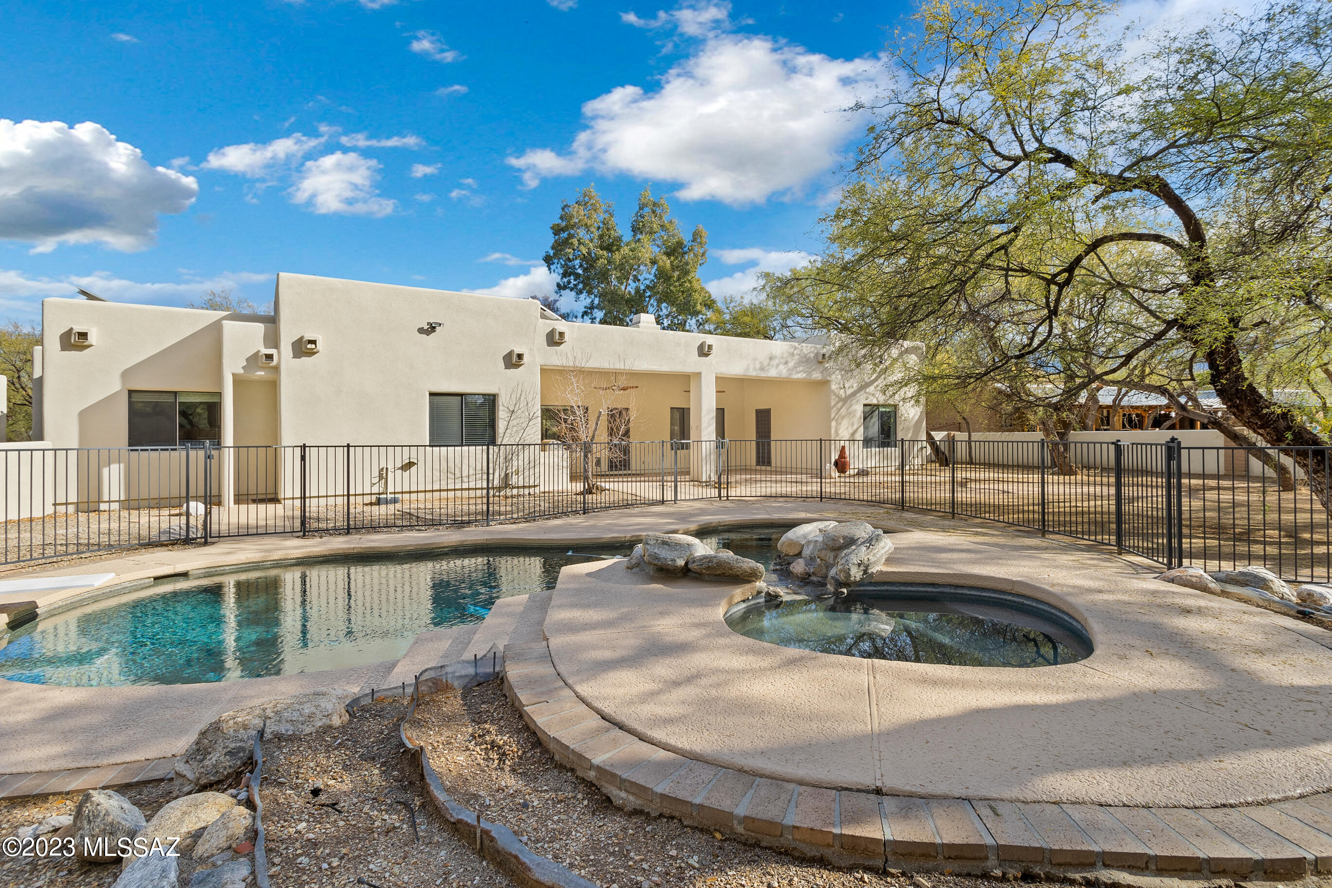 Wonderful 5 bedroom 3 bath home nestled in a mesquite tree bosque . Delightful backyard offers covered patio pool, spa and views of the fairway and mountains.