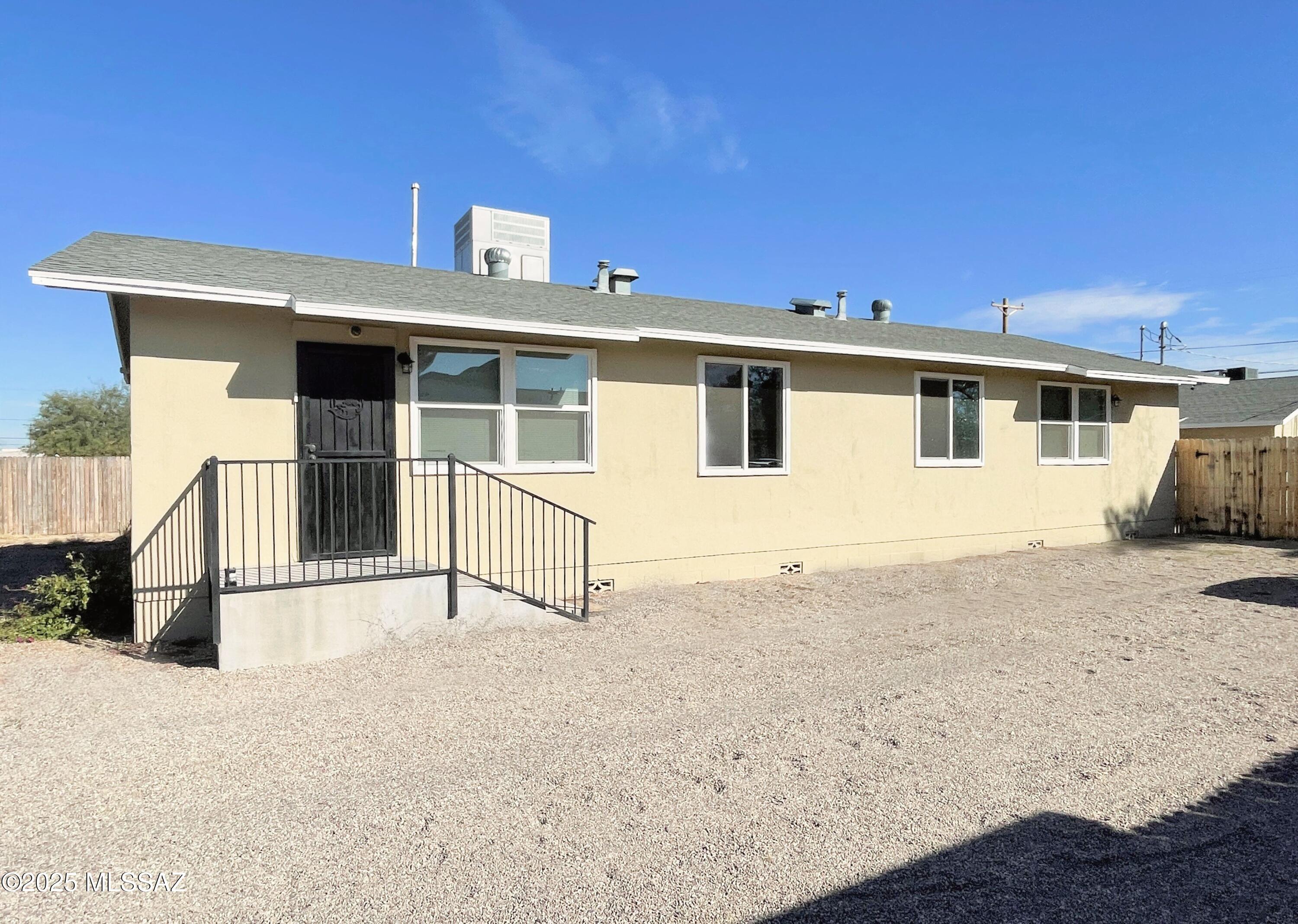 No Application Fees!  Remodeled single level 3 bedroom, 2 bedroom south Tucson home.   Upgrades include new laminate flooring throughout the home with tile in each bathroom. No carpeting. Two-tone neutral paint throughout with upgraded fixtures and ceiling fans in each room. Open kitchen with large dining area, granite countertops, upgraded cabinets, separate pantry, ceramic top electric range, stovetop microwave, dishwasher and refrigerator.  Larger master bedroom and oversized laundry room, washing machine and dryer included with additional storage area. Tenant to pay $50 monthly for water utility. All Denali Real Estate residents are automatically enrolled in the Resident Benefits Package (RBP) for $55.00/month which includes Renter's Liability Insurance, Credit Building to help boost the resident's credit scores with timely rent payments, up to $1M Identity Theft Protection, HVAC air filter delivery (for applicable properties), our best-in-class resident rewards program, and much more!