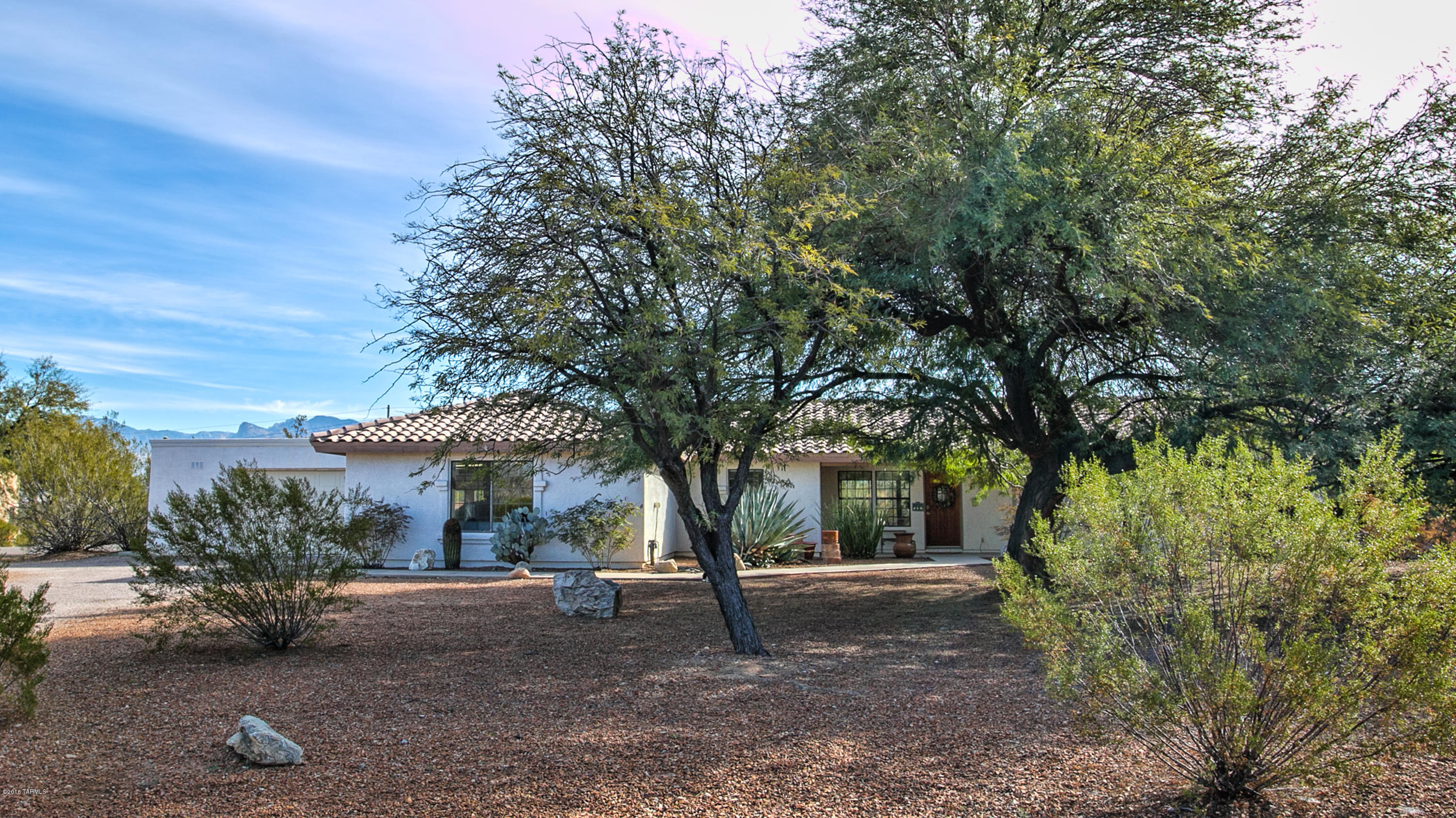 Enter into a bright and spacious 3 bedroom semi-custom home with TWO LARGE MASTER SUITES. Sited on a low maintenance xeriscaped lot approx. 0.8 acres. Living and dining areas have a large glass patio door inviting the yard area to join with the interior space. The east facing rear yard is completely walled for your privacy capturing panoramic mountain views. The patio has over 3,000 sqft of concrete sweeping out to the pool area. The home boasts two garages totaling over 1,200 sqft, parks four, plus a large shop and storage area. Located near shopping and schools. This home is well maintained and MOVE-IN ready. Come see....you will not be disappointed.