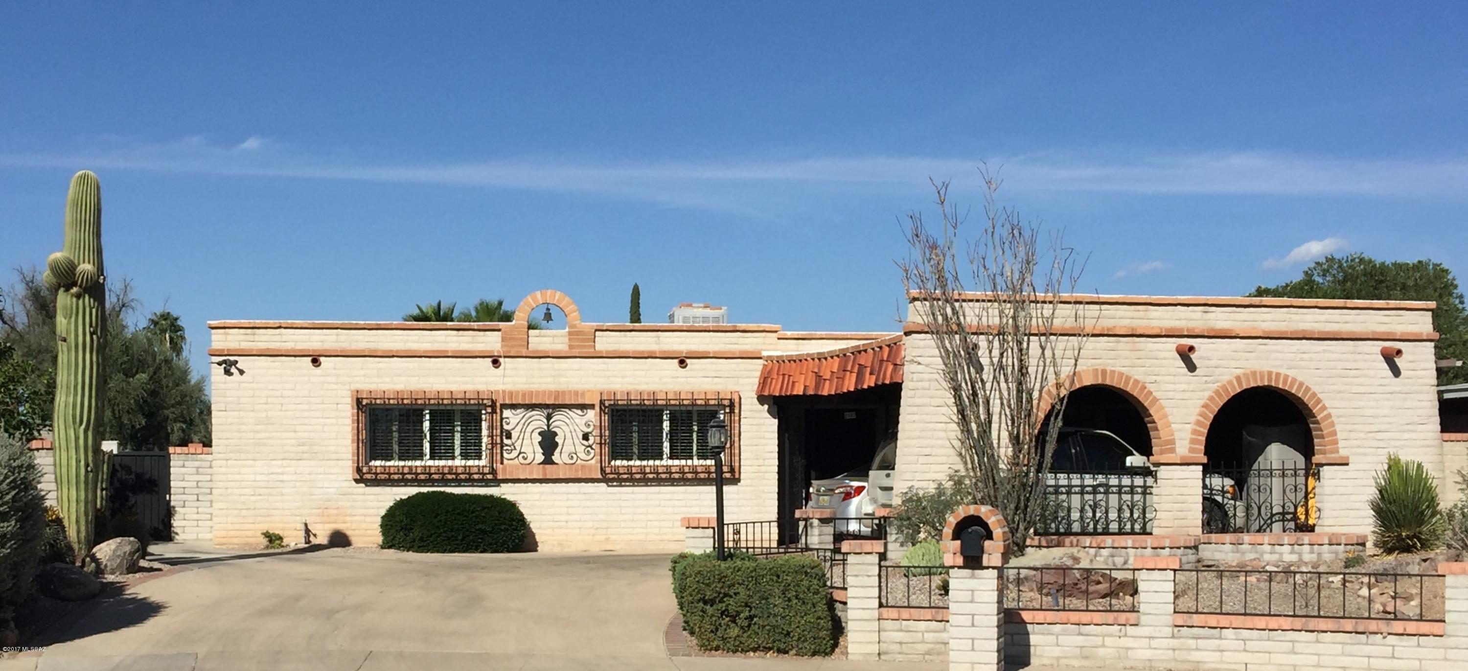 Remarkable 4 BR home with incredible views overlooking the 5th Fairway of Rolling Hills Golf Course, duck pond, and Catalina Mountains. Upgraded Anderson sliders and Milgard windows along with extra insulation (Per the original owner who was the construction supervisor) and Dual Cooling makes this a very comfortable retreat. Quiet, well established neighborhood, close to shopping with no Home Owners Association means No HOA dues. Storage closet off carport and an extra storage shed for all your toys and equipment. Pantry and other cabinets in Laundry Room. Decorative tile on Breakfast Bar and Kitchen backsplash.  Builtin BBQ for all those cookouts. Heated pool and spa just replastered and new pump and filter just in time for swim season. Must see this home.