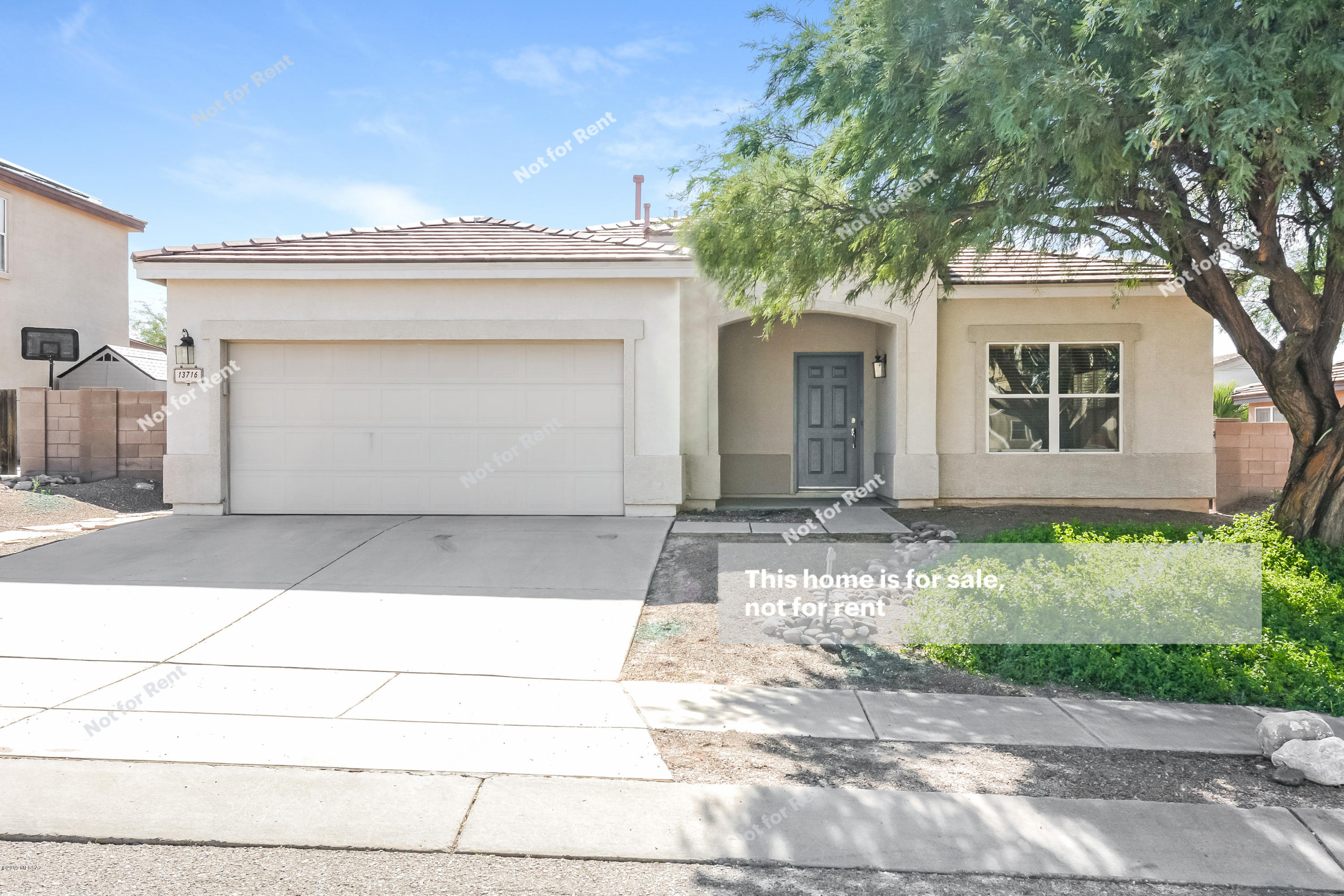 This Vail one-story offers a kitchen island, stainless steel appliances, a patio, and a two-car garage.