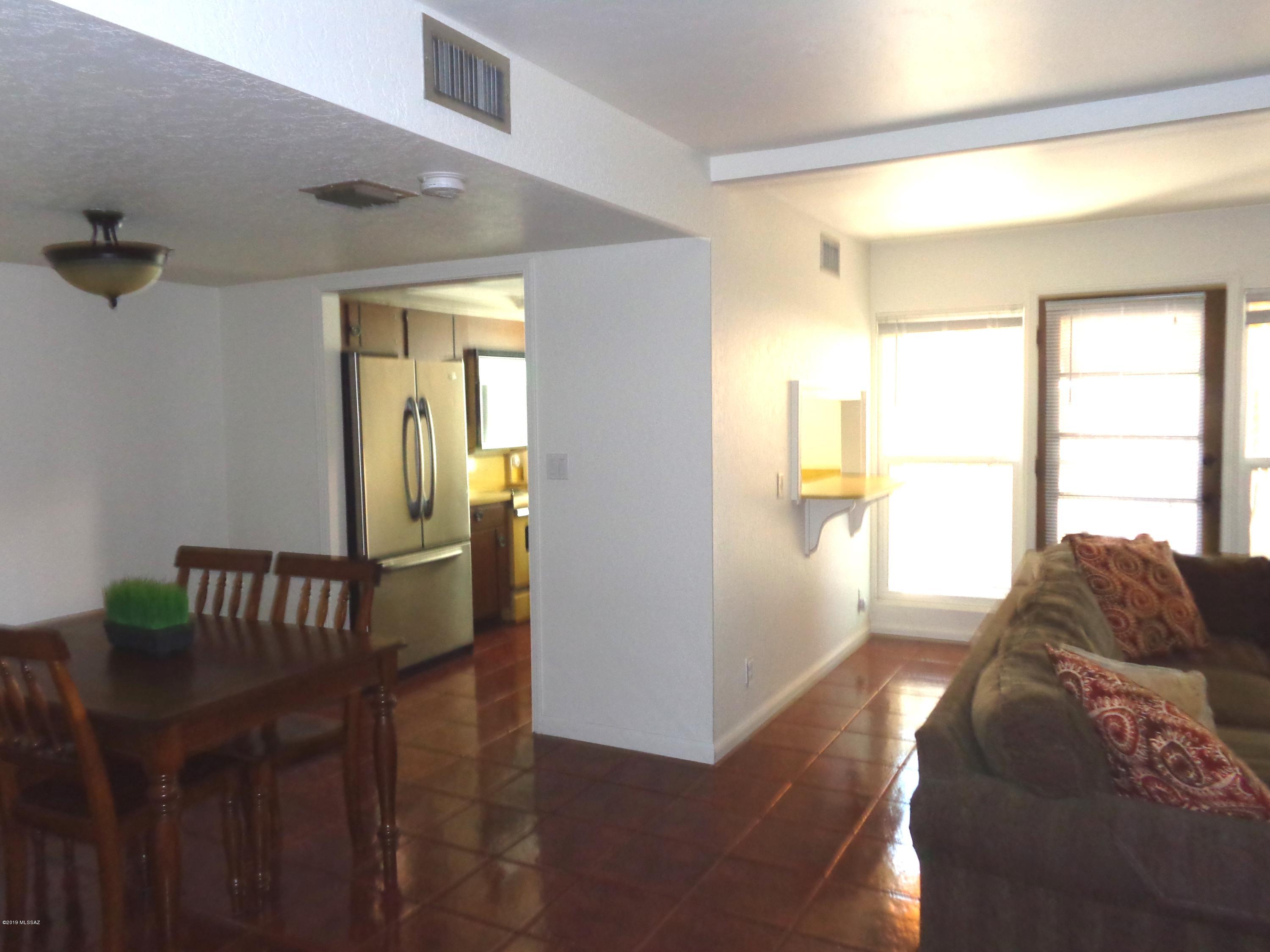 Prime, central location – close to shopping and dining, and an easy commute to I-10!  This spacious townhome is situated between Campbell Ave and the Mountain Ave bike path – perfect for students at the University of Arizona. The large carport has room for two cars and there's ample covered guest parking close by.  The Valle Cereza community offers a sparkling community pool, basketball court and playground.  Recent upgrades include: new roof, complete termite treatment and new A/C in 2016; patio pavers and patio cover, new water heater 2017; new garbage disposal 2018; newer dual pane windows.   Great value for a 3 bed/2.5 bath home – call for your private showing today!