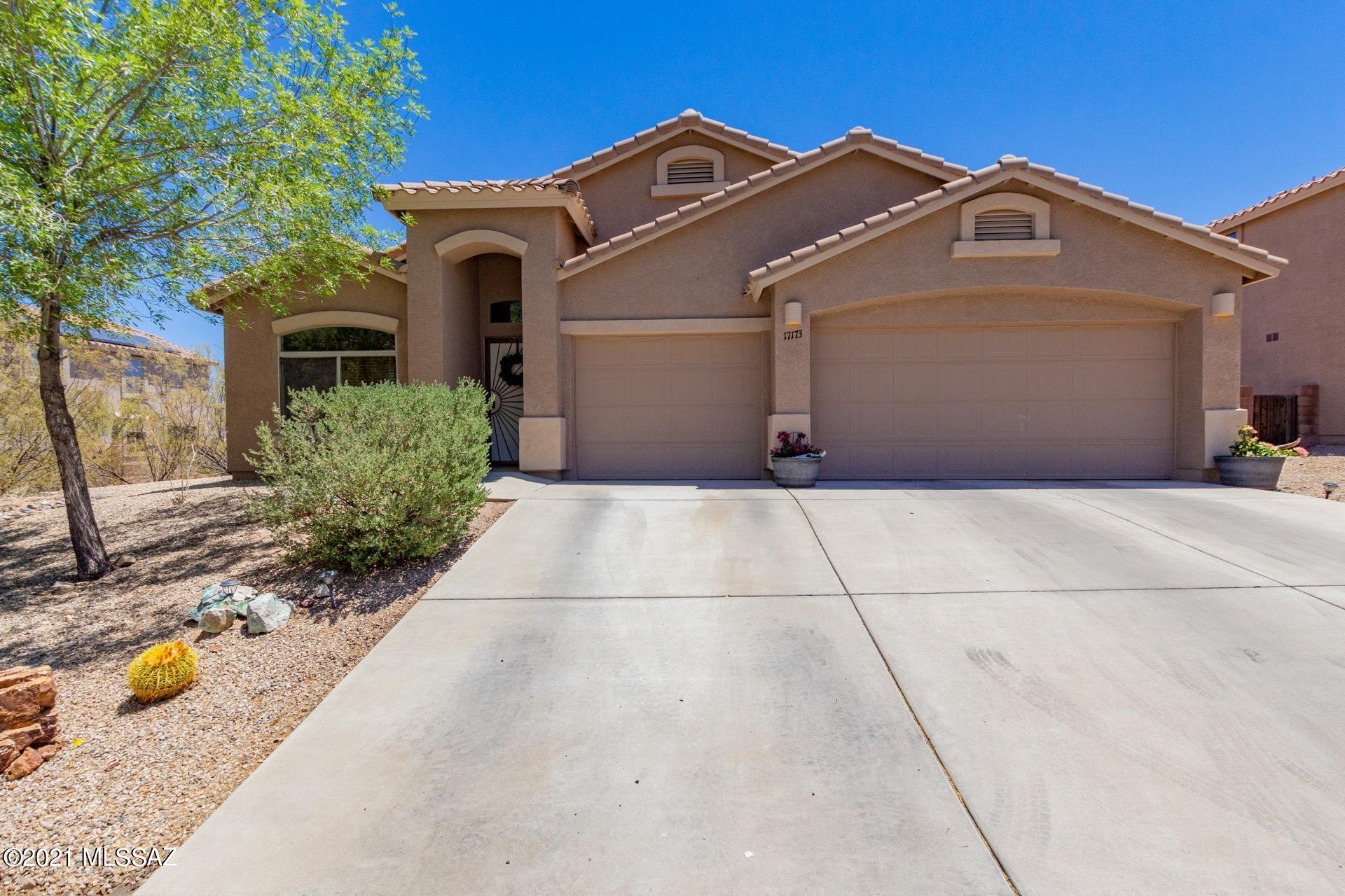 Views! Beautiful 4 bedroom 2 bath w/den home in the sought after Vail School District and located in the lovely subdivision of Sycamore Canyon. The open concept floor plan w/vaulted ceilings is welcoming and bright. The kitchen and dining areas allow you to be in the kitchen but still close to guests as you entertain. Master bathroom has dual sinks w/private access to the backyard. Large walk in closet in the master. An elevated lot with views, covered back patio, double side gate,  & fire pit. This backyard is great for entertaining or enjoying the peaceful tranquility of the desert, sunsets and mountain views. The  3 car garage will provide ample space for your vehicles and toys.  Enjoy the amenities of the community pool, park, basketball court, bike paths and desert hiking trails
