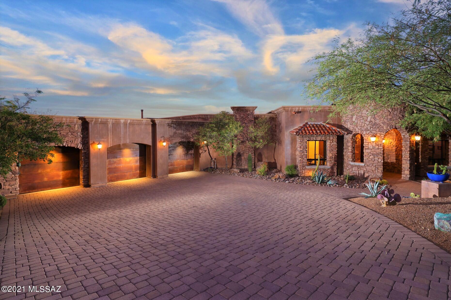 LOCATION, LOCATION, LOCATION. Nowhere else in Tucson can you find the convenient relaxing resort living, panoramic city and mountain views in a world class environmental master plan than Starr Pass surrounded by the Tucson Mountain Park. YET minutes away from Downtown vitality, Raytheon, Caterpillar, Amazon, UArizona, Pima College West, Hospitals and all necessary conveniences.  This FANTASTIC home is nestled right next to 100's of acres, where one can enjoy bird watching, animal migration, dark sparkling skies and of course twinkling lights of Tucson. Property includes membership initiation fee for highest priced JW Marriott Starr Pass Resort and Spa membership.  This is a hikers, bikers, birders, star glazers paradise.    Enter the home through massive doors to the foyer & entertainment room with grand doors to the large covered patio and negative edge pool and spa. Followed by a wonderfully designed with wooden cabinets and top upgraded kitchen and great room with dining and bar! Three bedrooms all with on-suite baths and forth bedroom converted to office and 350 bottle wine cellar. There are so many things to admire, solid wood, travertine flooring, Cantera stone fire places, Venetian glass, wet bars, bath exiting to pool area. The pictures, the video tell the story - nature and LOCATION will speak for itself. All furnishes in the documents under Bill of Sale convey at zero dollars. AGENTS are the primary Brokers for the Developers of Starr Pass since 1993 - we are here to serve you.