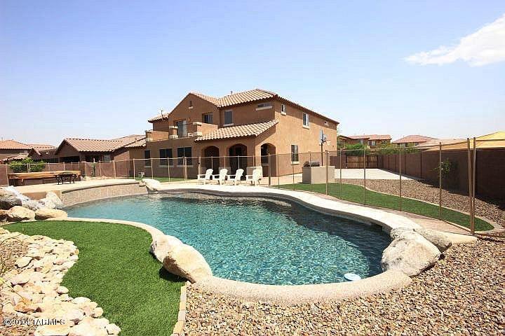 This is a long term lease to purchase agreement. Gorgeous 6bd/3bth home with the Perfect yard for entertaining! Huge Pool with raised platform area and detached Spa. Lots of upgrades in spacious home! Separate formal living room off of entry, and great room layout with luxurious kitchen and family room. Separate entertainment room off of the family room. Half basketball court, large covered patio with balcony off of master suite!  This house is located in desirable Tangerine Crossings, a gated community with two community parks!