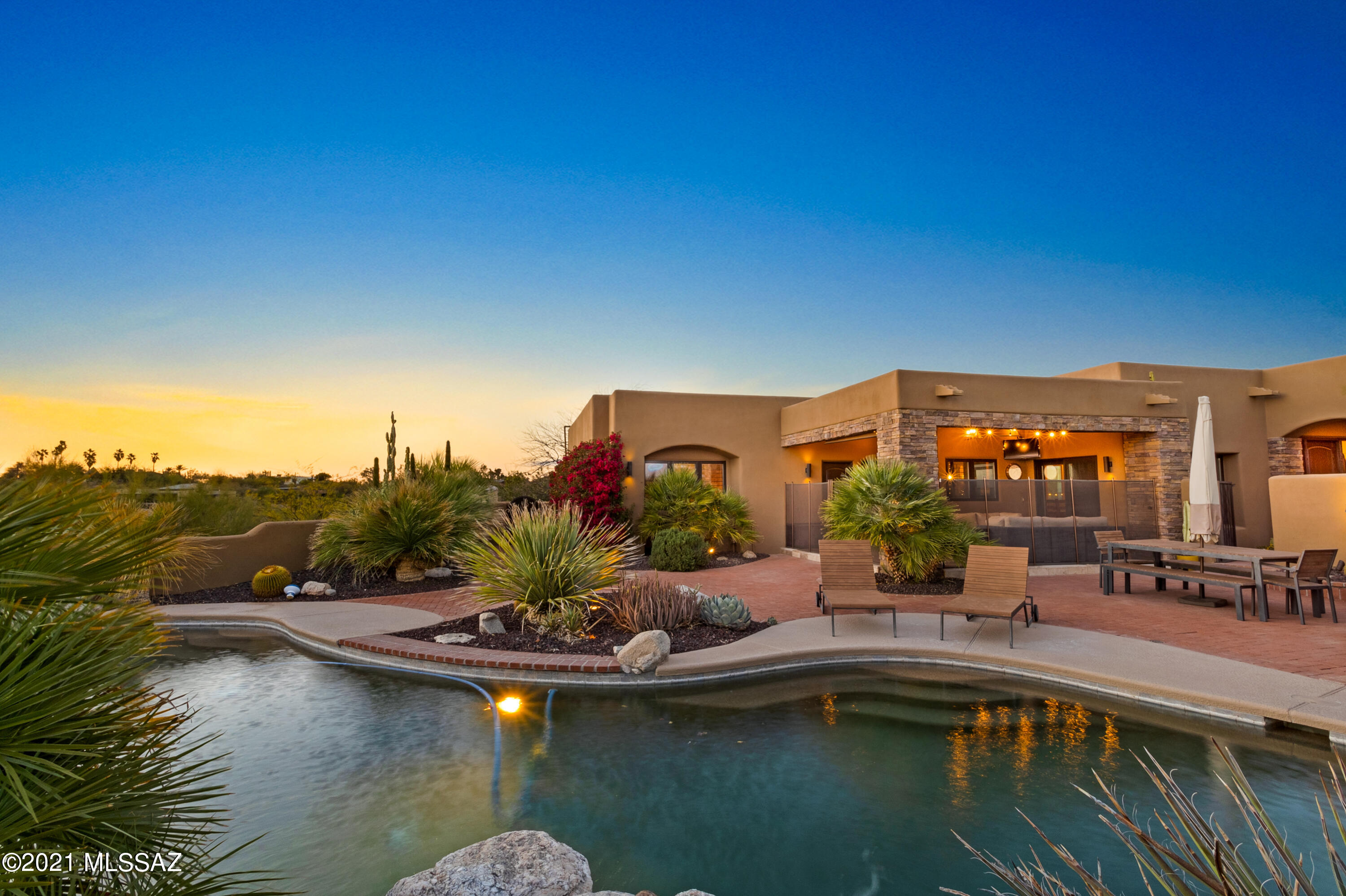 Fabulously updated home in wonderful Hacienda Del Sol Estates. Terrific mountain and city views inside and out. High beamed ceilings in greatroom with large wood framed picture window framing mountain view. Open, renovated kitchen with high end Thermador and Bosch appliances, with Grohe fixtures. Huge walk-in pantry. Natural stone floors and base boards throughout.
Split bedroom floorplan with additional den/office, plus sitting room off the owners suite. Soothing owners bath is a retreat with beautiful walk in shower. Light and bright home with wood framed windows, skylights, recessed lighting and high ceilings. Amazing laundry room with high end soft close cabinetry, large window and butcher block counter tops. Solid wood interior doors. Wonderful three car garage with epoxy floors. Two walled in yard spaces, one with turf and plenty of room to play, the other with a fabulous pool, built in grill and amazing city and sunset views. Fabulous patio of owners suite sitting room. Beautiful stacked stone surrounds.