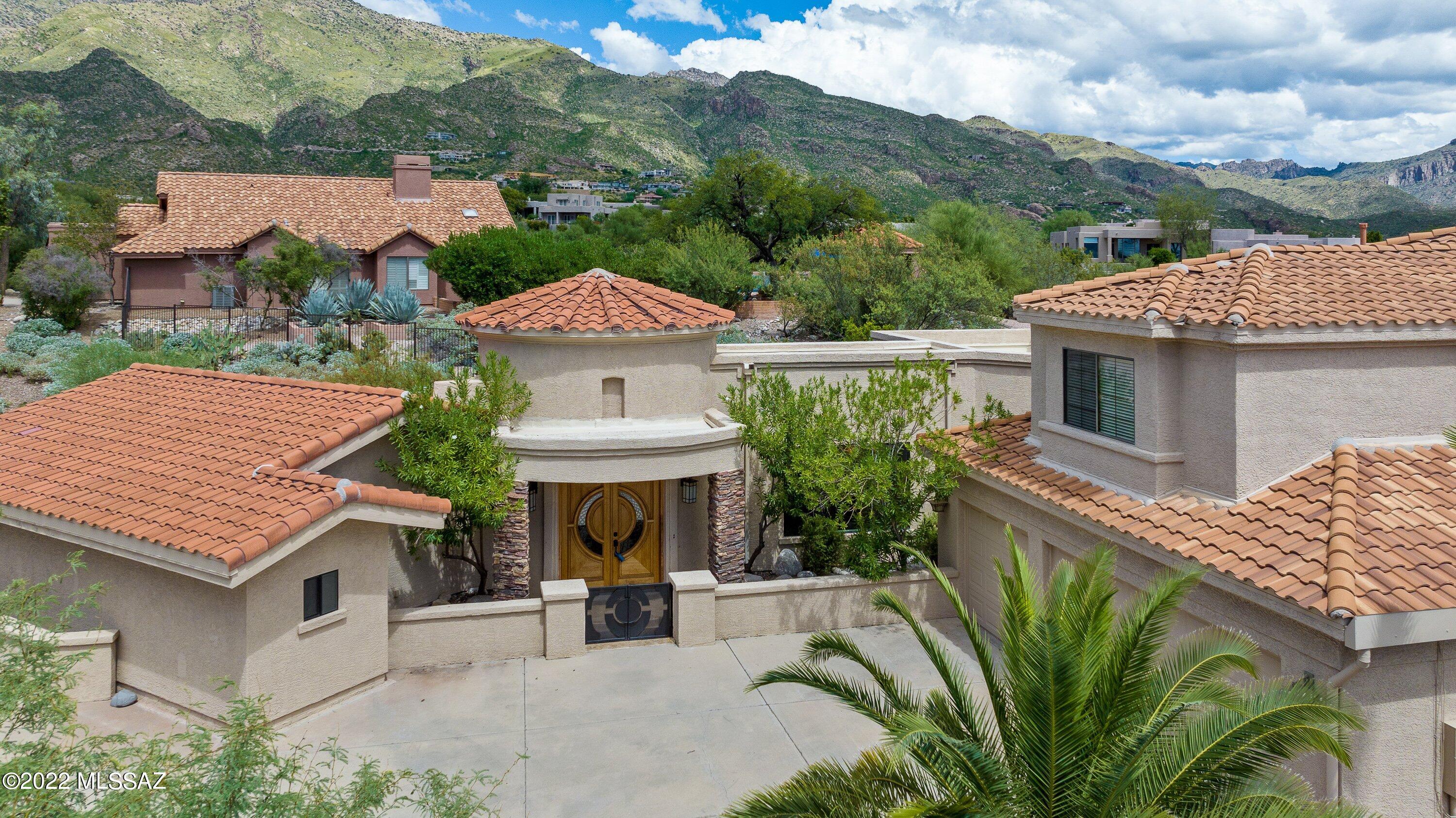 Extremely rare find in Casas de Ventana.  4574 sq ft, 5 BR, 4 Bath home with pool and spa located on a premium near 1 ac lot bordering Ventana Canyon CC Golf Course.  Enter this meticulous home through a large bright foyer with a high recessed ceiling. Adjacent is a large multi-purpose room with wood floors and beamed ceilings currently used as a media room.  Could also be an additional BR.  Massive kitchen that has been beautifully updated to include Thermador ovens and opens to a cozy family room w/FP.  Large guest suite with 2 closets and walk out to the covered patio. Upstairs is a spacious master suite with balcony, 3 additional bedrooms and additional full bath.  Step into the quiet backyard area with 2 separate patio areas, outdoor kitchen, and fireplace with lovely mature trees.  Pool and spa are in a gated secluded area.  Also a separate play area for the kids.  This is a delightful family home you'll want to see.