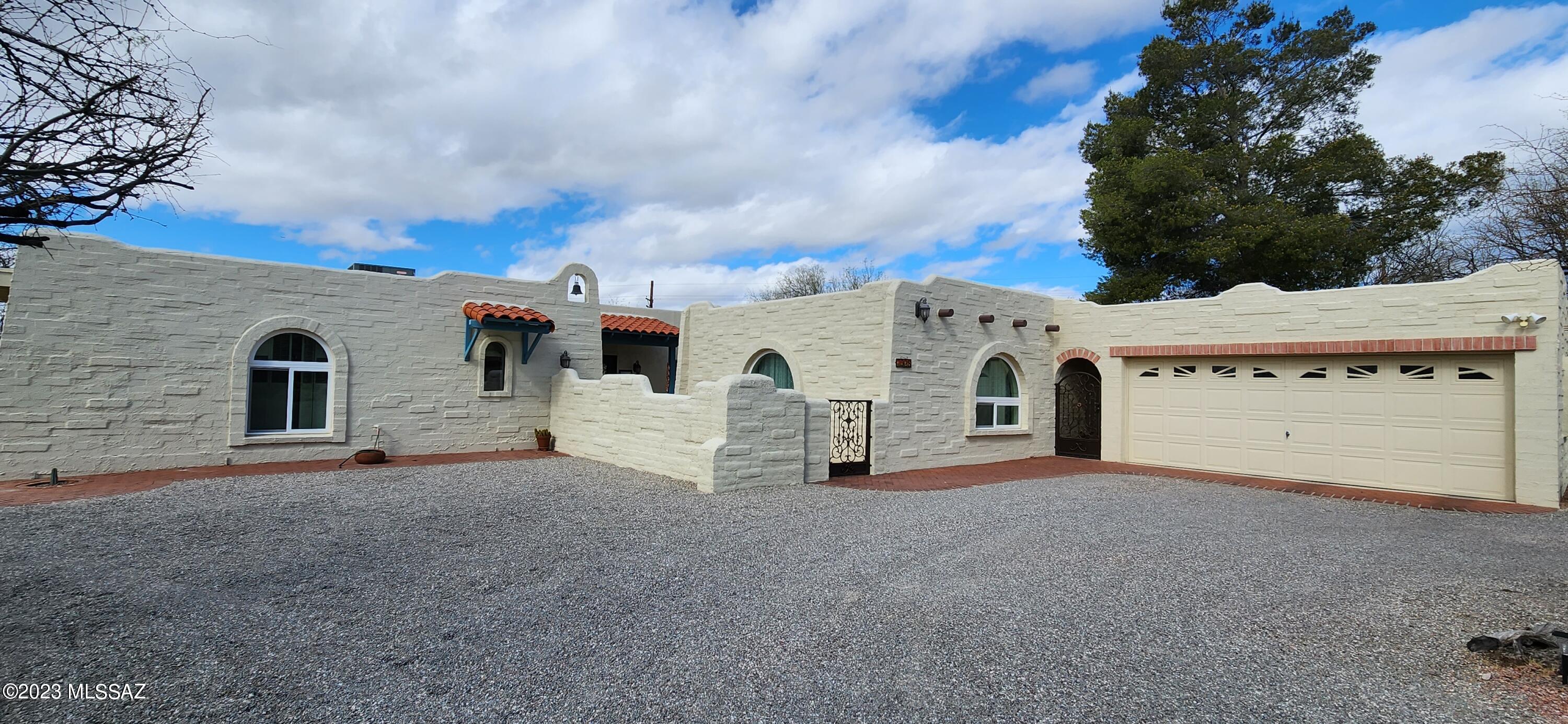 Unique Santa Fe Style Ranch located within 1/2 mile to Sabino Canyon Recreation area and all of its trails!  This home is in the popular Catalina Foothills School District and is within 1/2 mile from two of its schools!  This home features stunning mountain views from its gated and bright courtyard and experienced a complete remodel and addition in 2019!  All new Milgard windows/doors, new upgraded elec. panel, new sewer line, new tile flooring everywhere, all new custom cherry kitchen with quartz countertops, high end appliances, a 7yr warranty roof coating, new master bathroom remodel,ALL new paint, 230 sq ft+ new patio coverage, pool deck restoration and paint, new custom gates and front door, 600+ media room w/ bar added! See amenities list, do NOT miss out on this home!